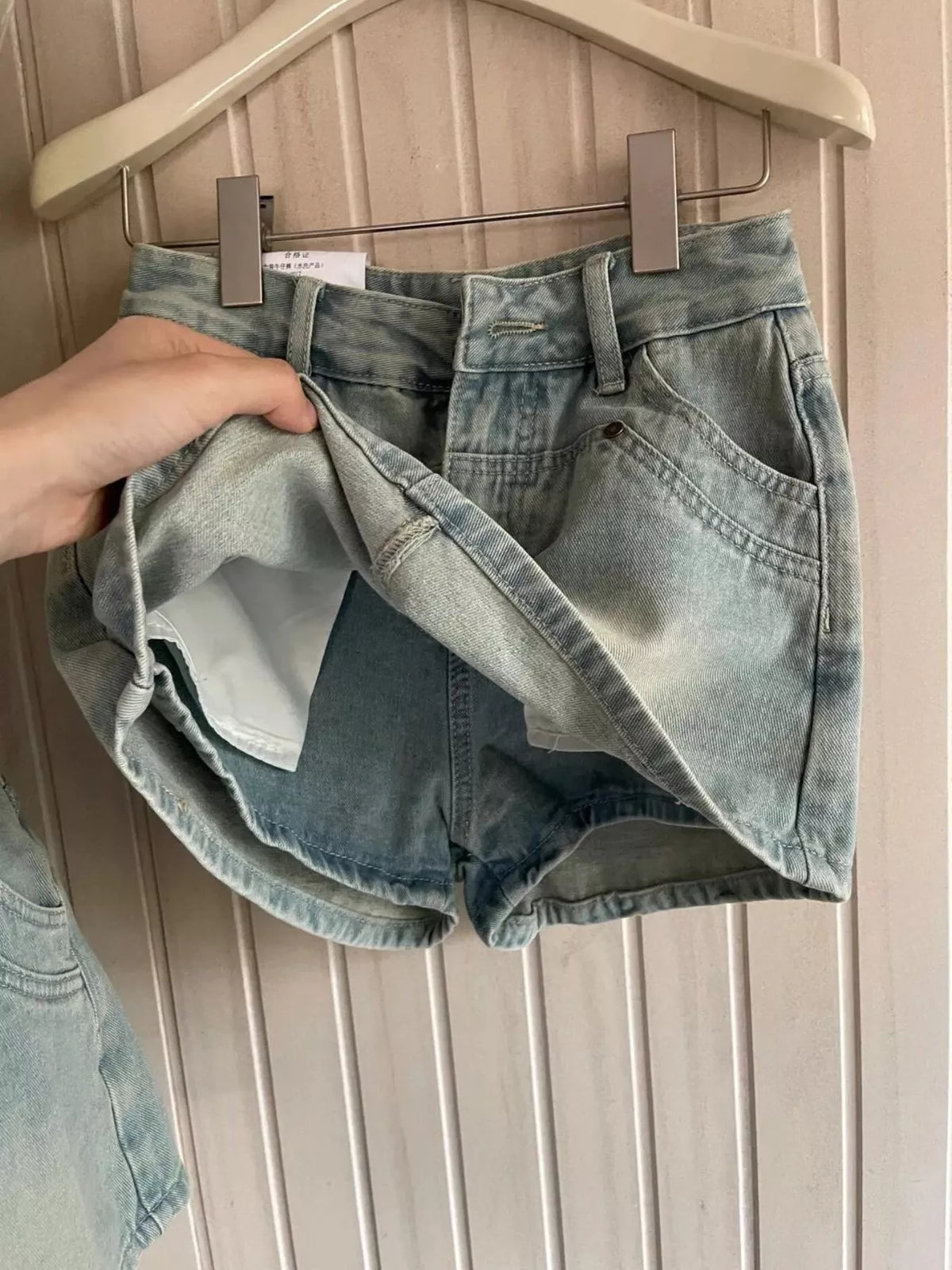 Denim shorts, blue shorts under overlay