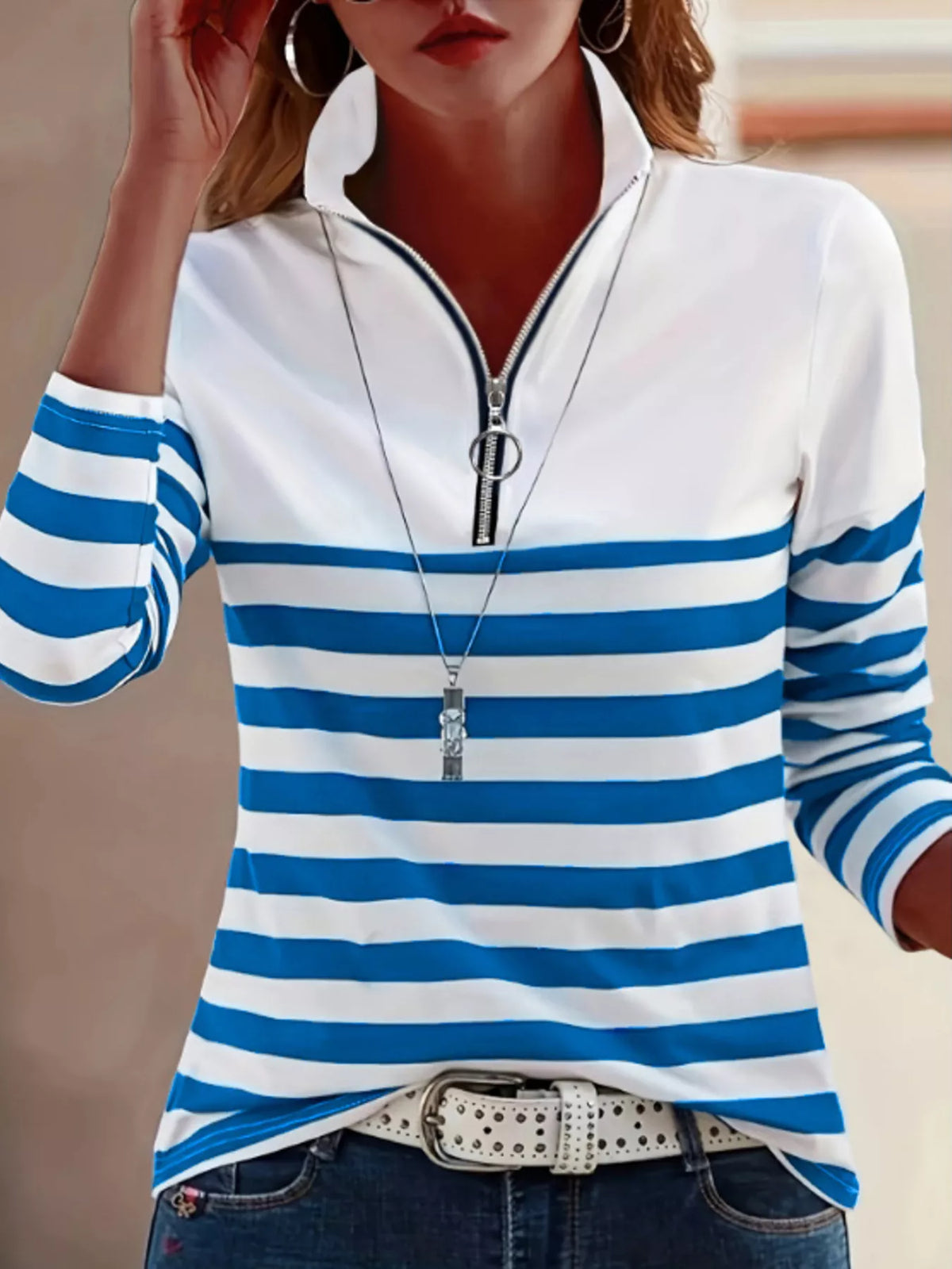 Blue and white quarter-zip striped top, front view