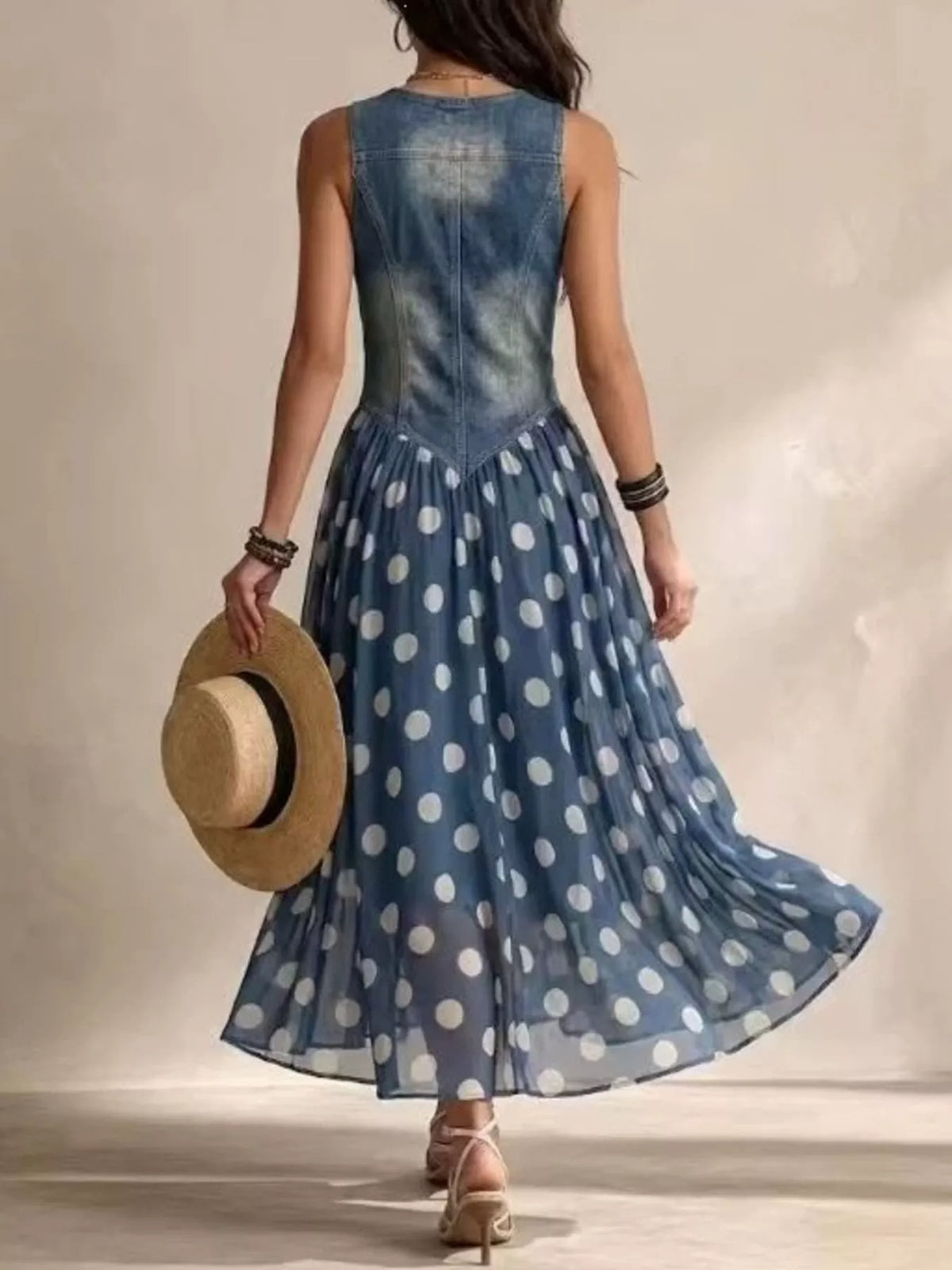 Blue polka dot sleeveless maxi dress — back view