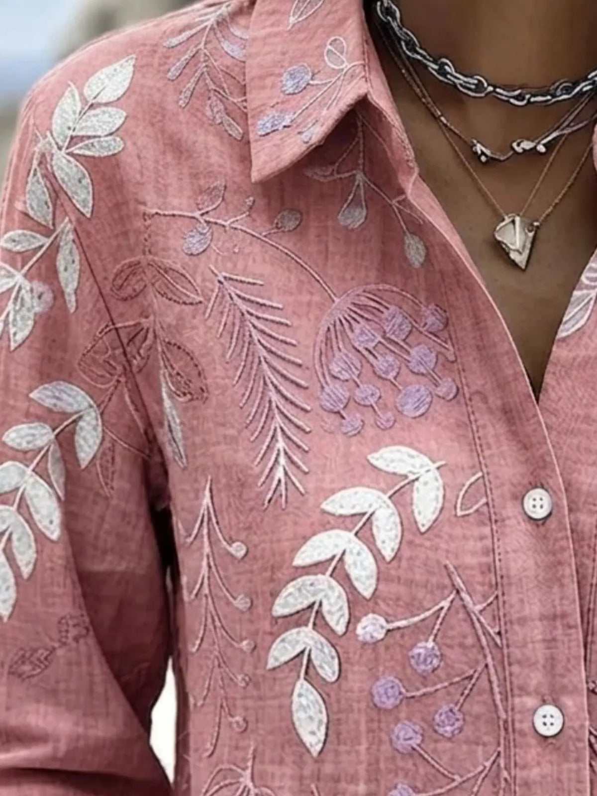 Pink leaf-embroidered button-down shirt, collar and leaf embroidery detail.