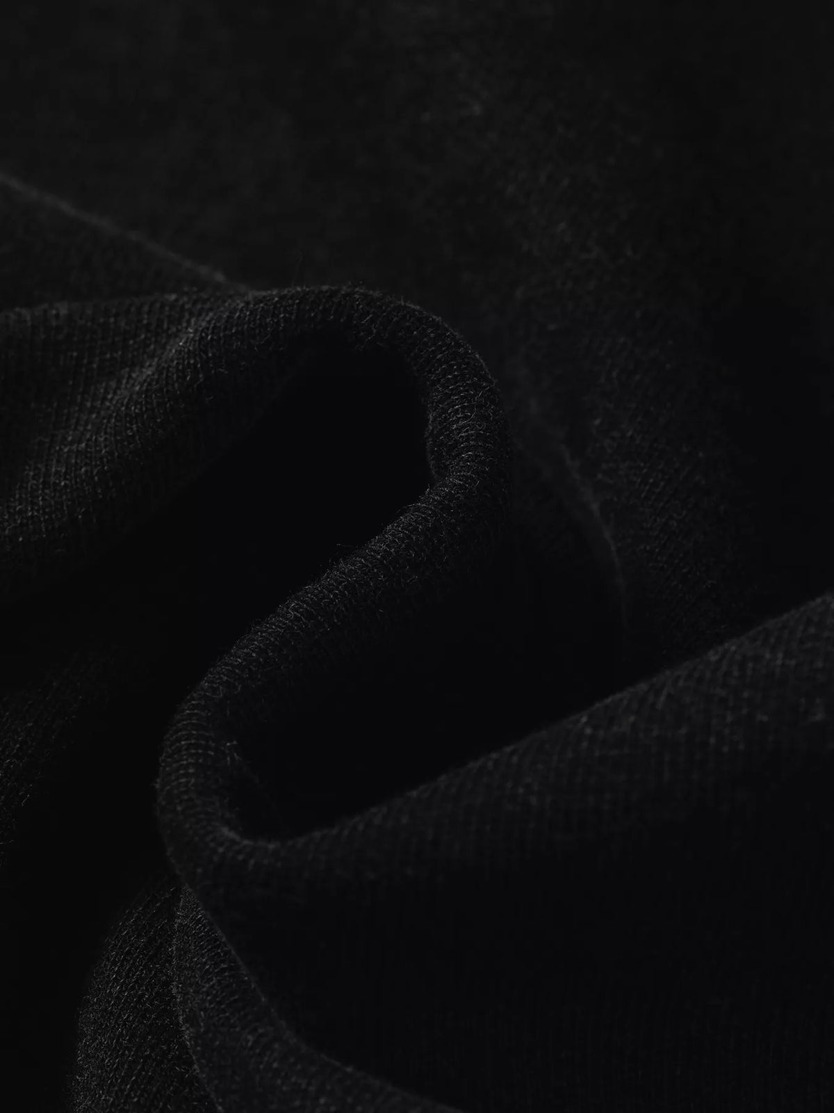 Plaid-sleeve hoodie, black fabric close up