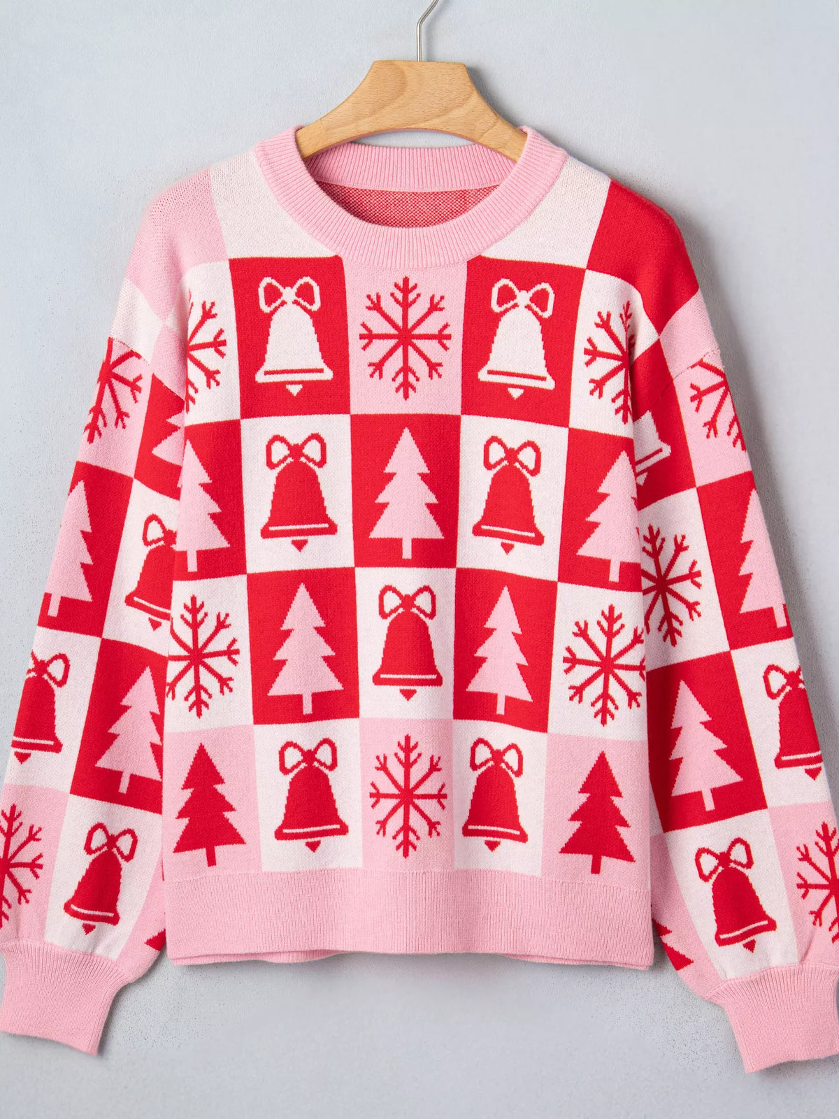 Pink and red Christmas patchwork round neck sweater — front view
