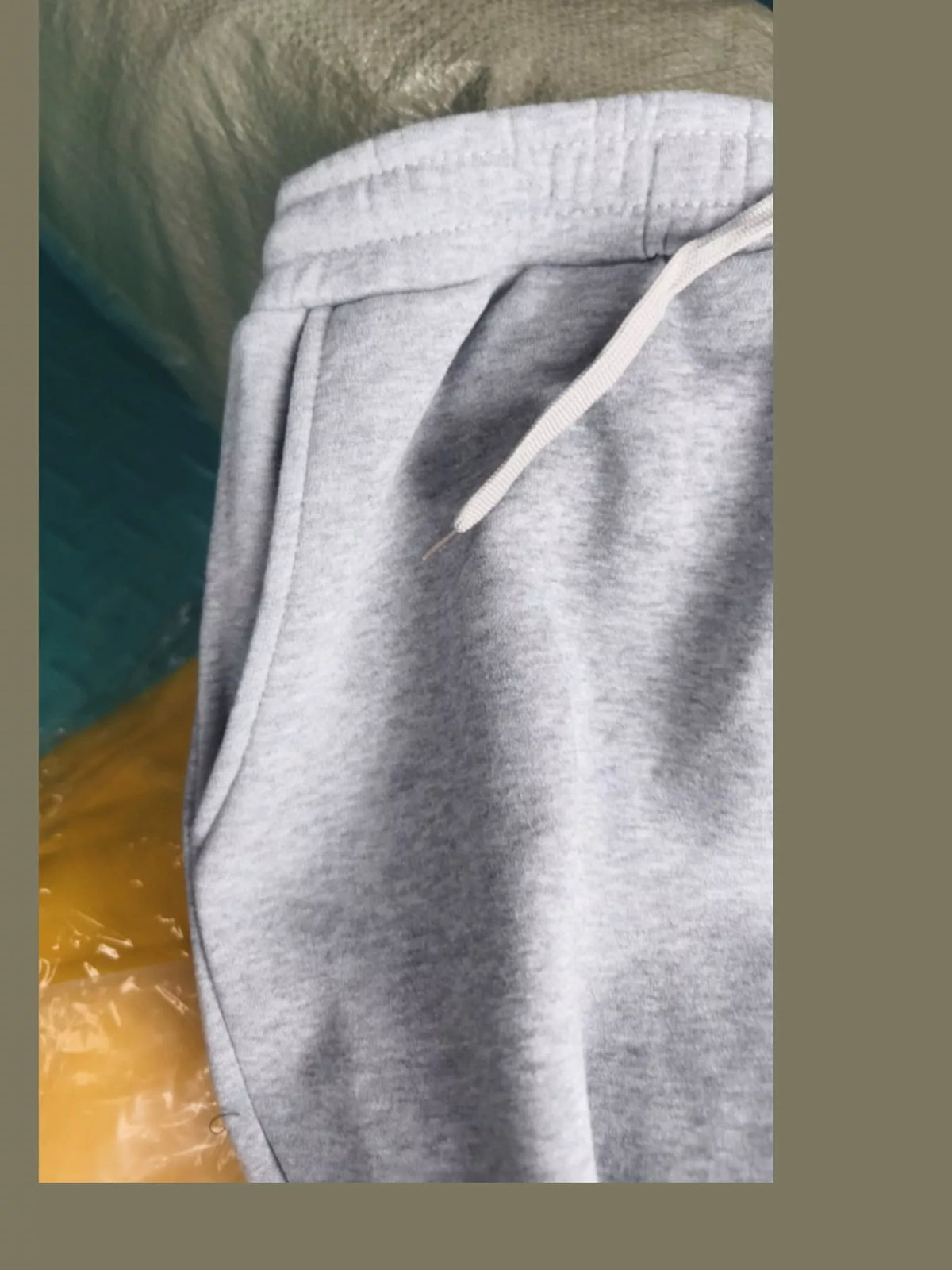 Waistband and pocket detail of wide-leg drawstring pants