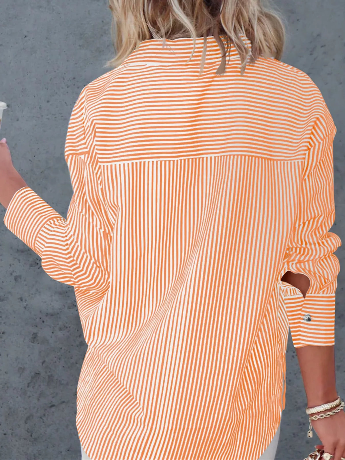 Orange striped button-down shirt, back view