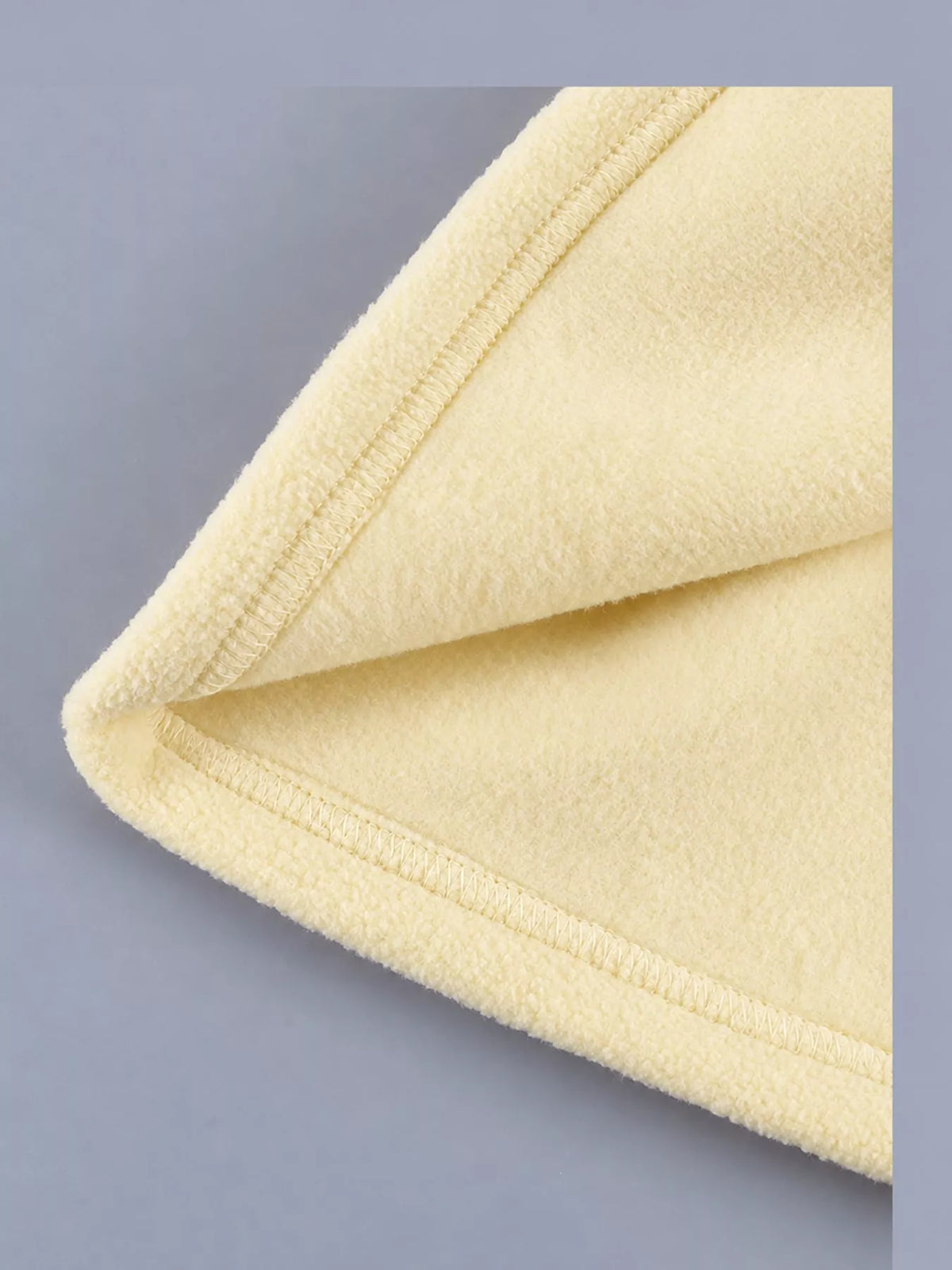 Yellow drawstring fleece zip-up jacket, detail view