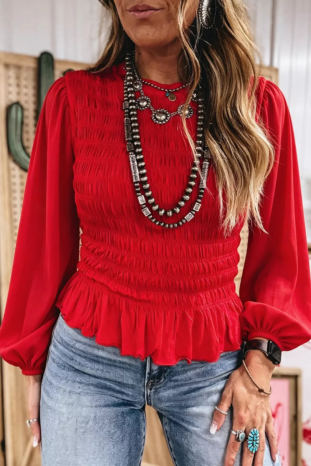 Smocked balloon-sleeve peplum blouse