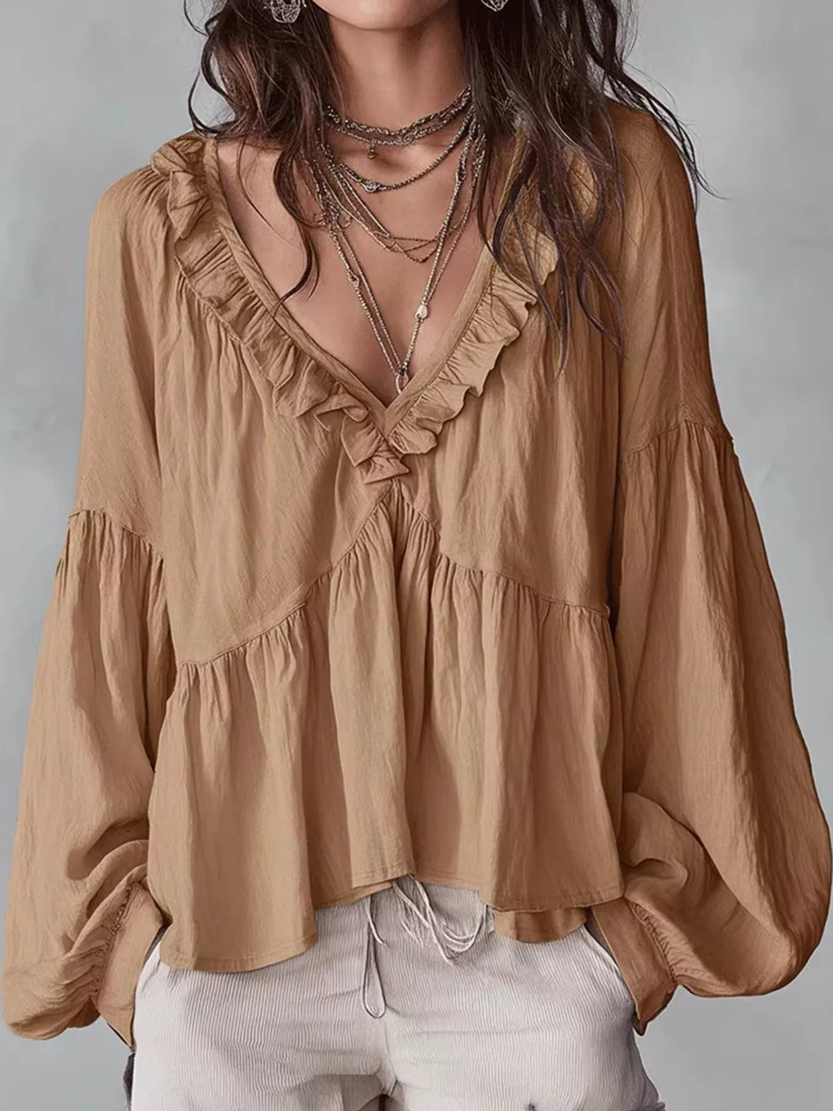 Tan ruffled v neck blouse, front view