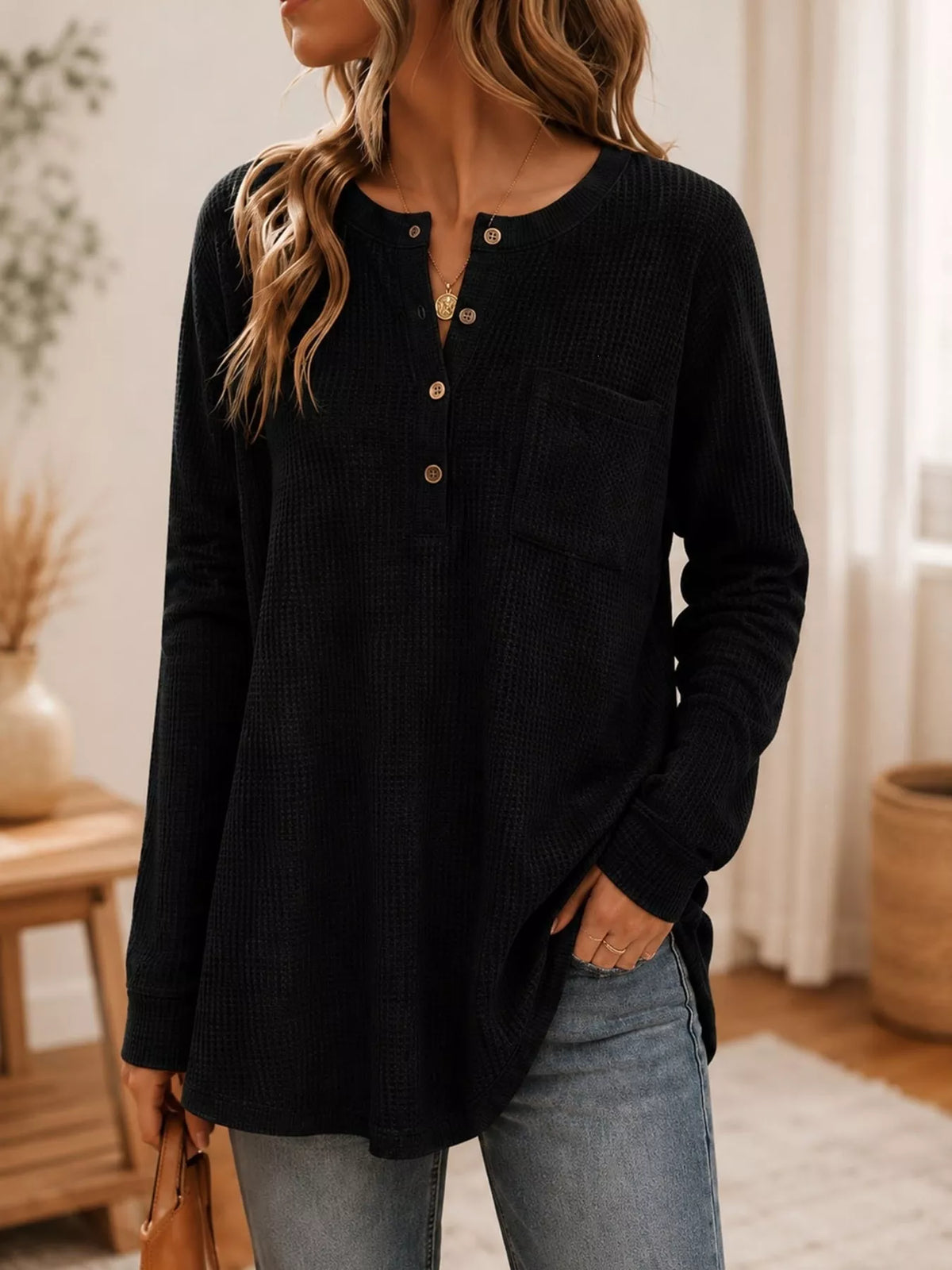 Black waffle-knit button-detail top, front view