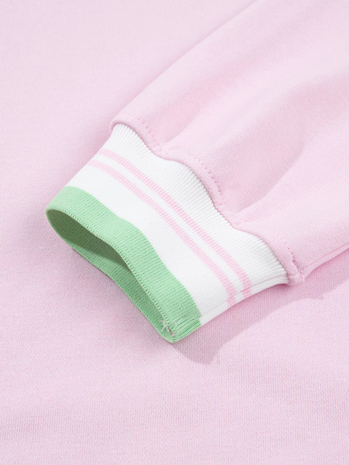 Pink sweatshirt with contrast striped ribbed trim, cuff detail