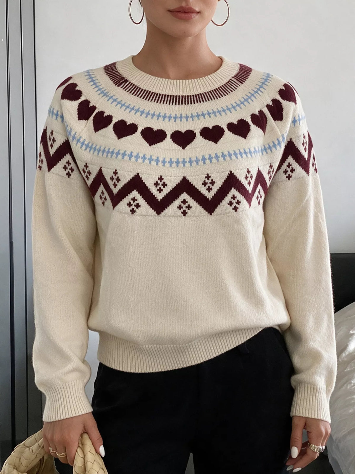 Cream heart-patterned crew neck sweater, front view