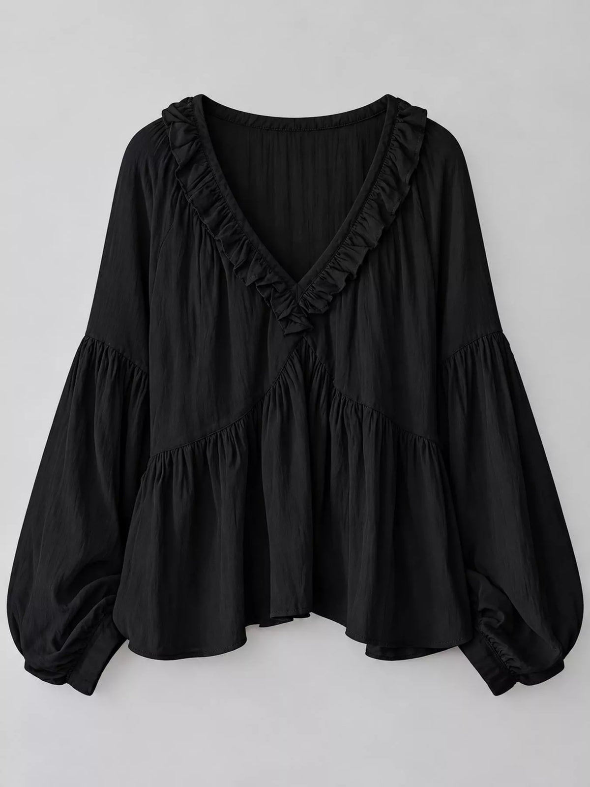 Black ruffled v neck blouse, front view