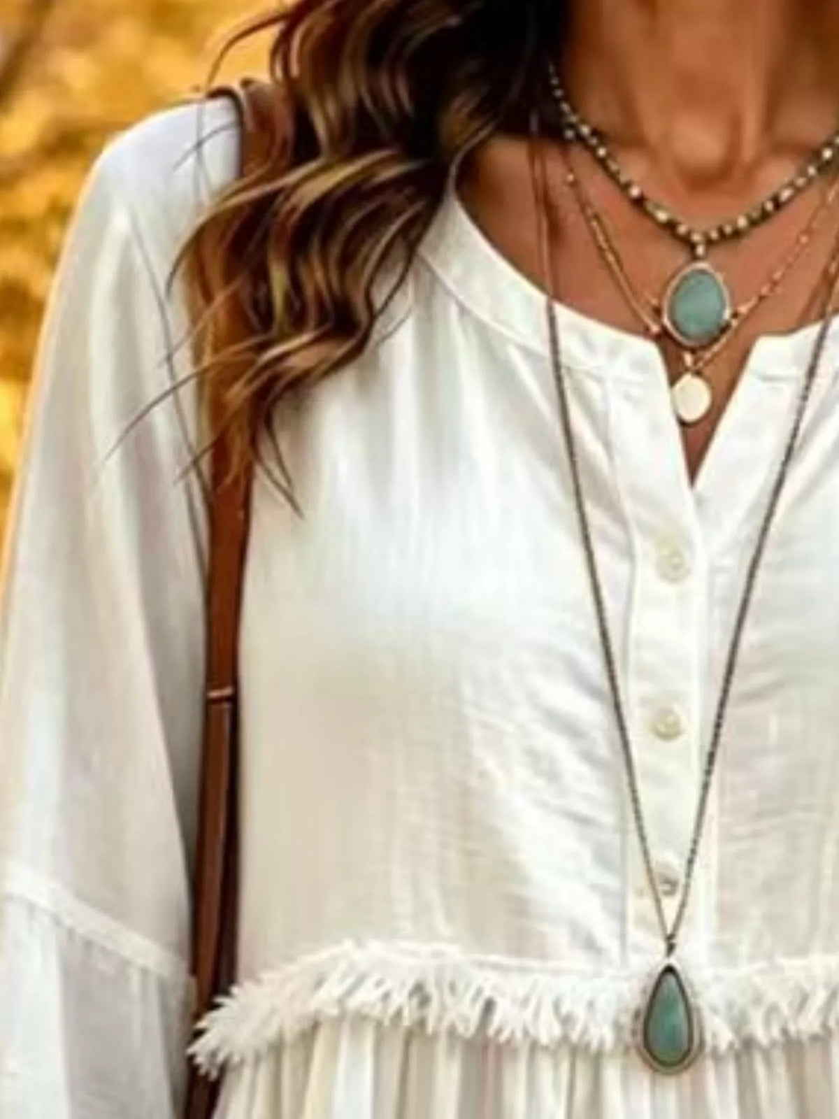 White fringed button detail blouse, split neckline, front buttons, and frayed waist seam