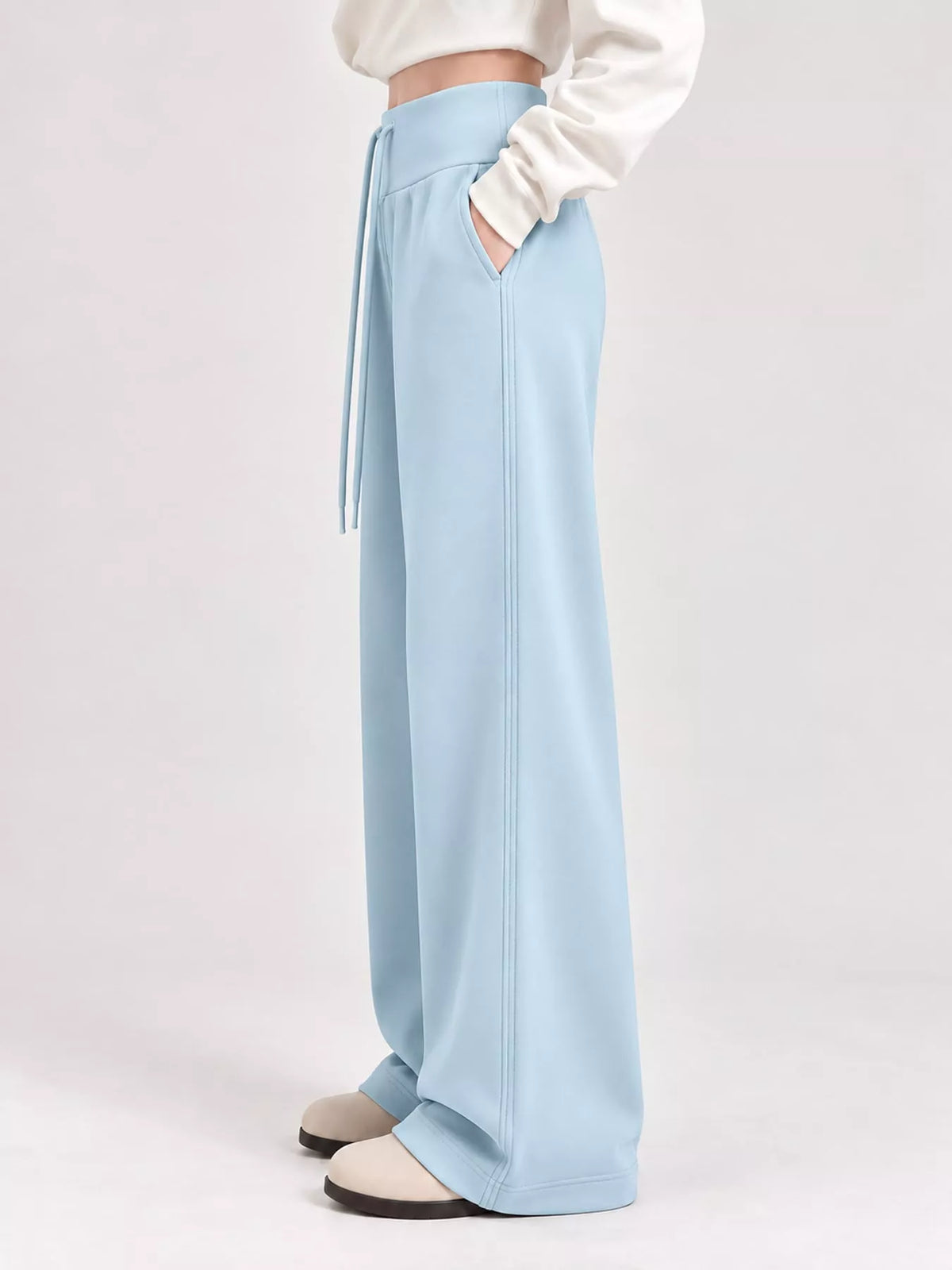 Light blue drawstring wide-leg pants — side view