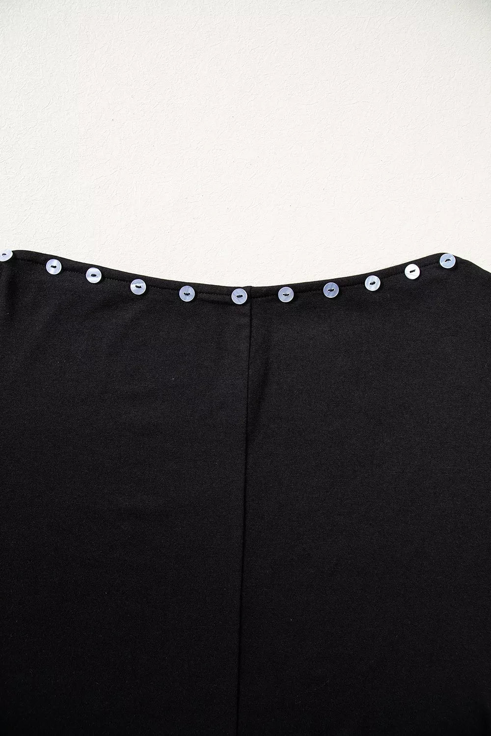 Black off-shoulder button-detail three-quarter sleeve top, back neckline detail