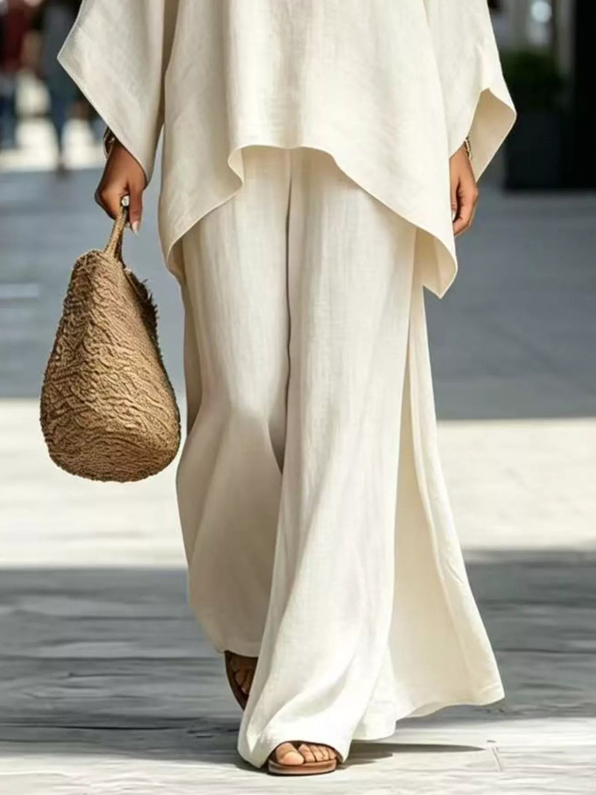 White matching wide-leg pants and top hem detail