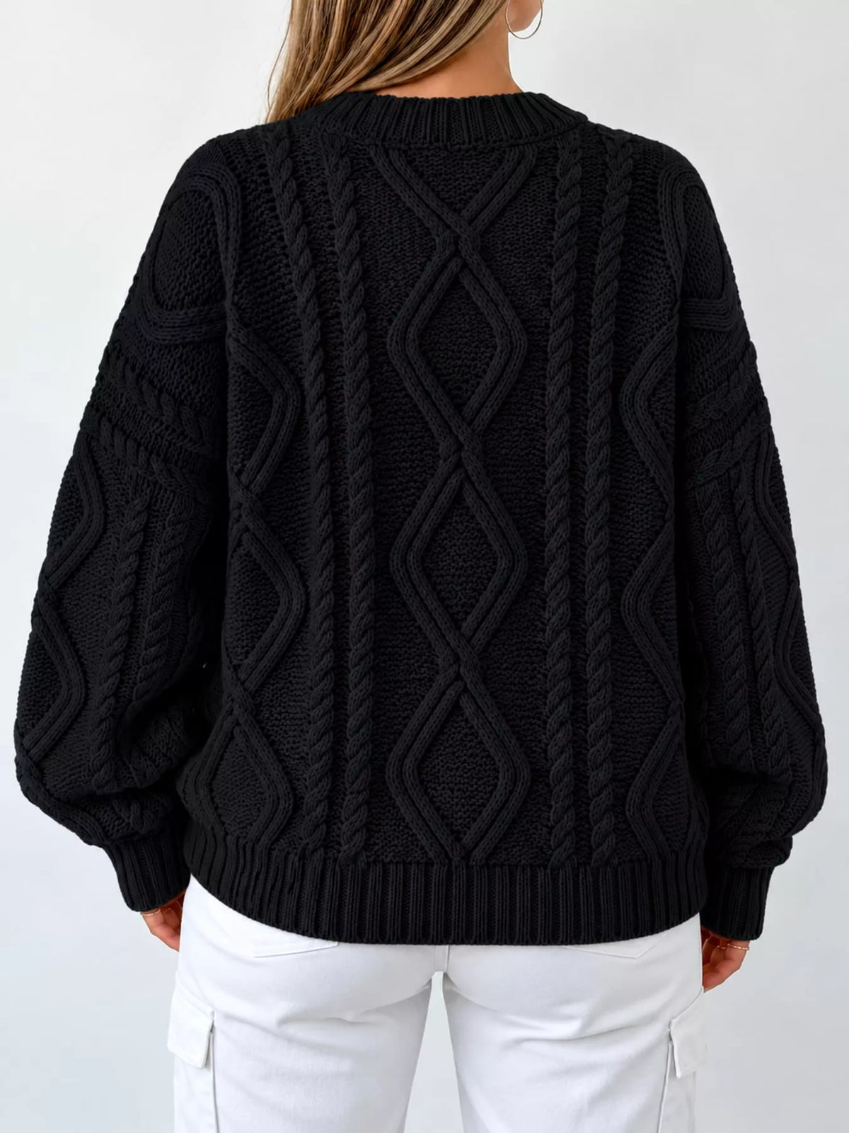 Black cable-knit round neck sweater, back view