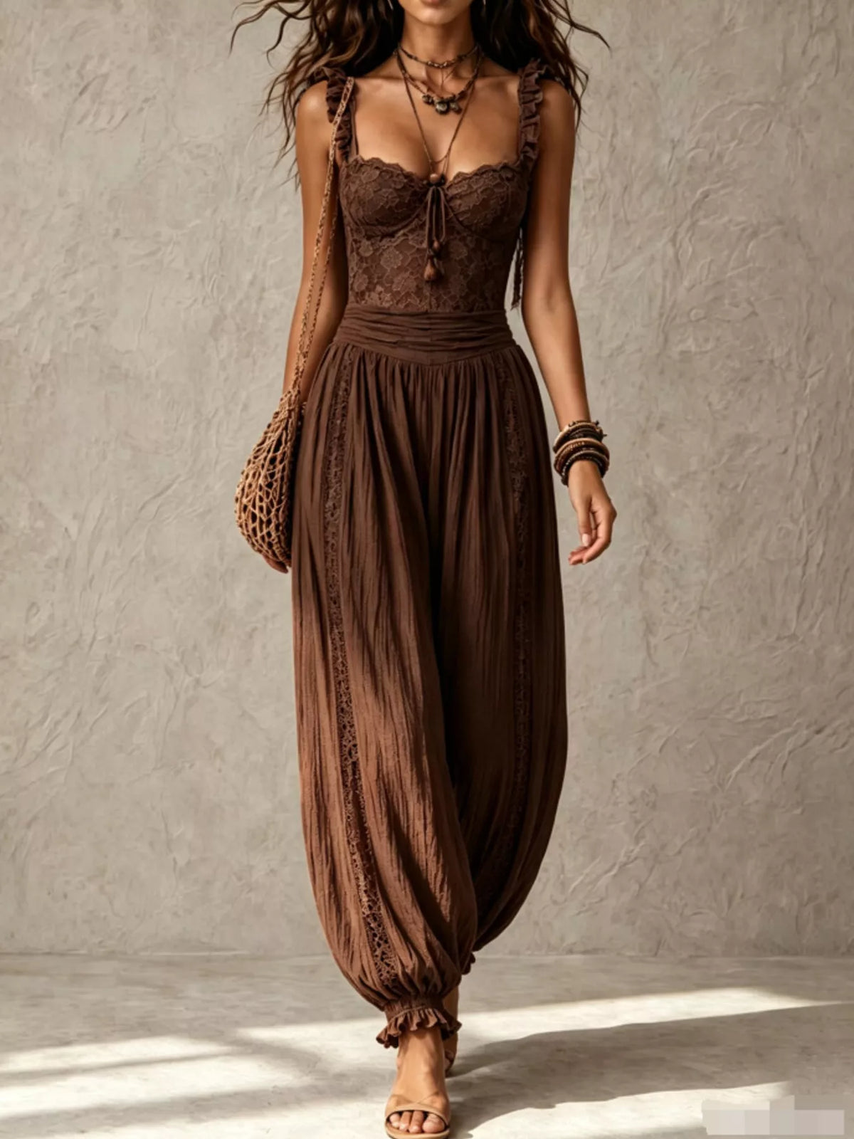 Brown lace-bodice harem-leg jumpsuit, full front view.