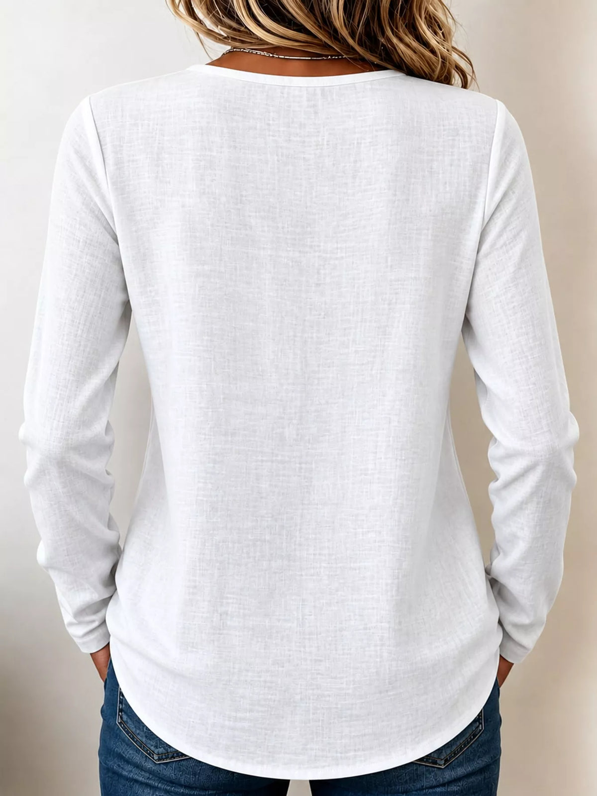 White long sleeve decorative button blouse, back view