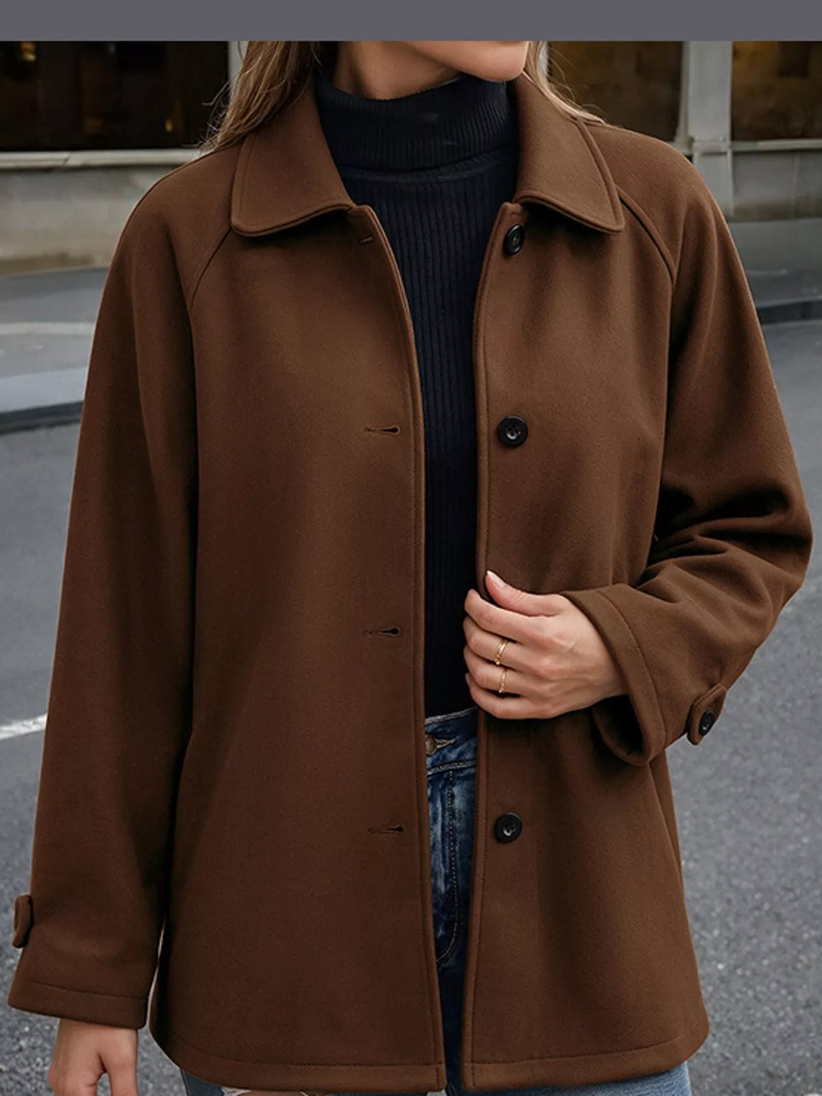 Brown button-up raglan sleeve coat — front view