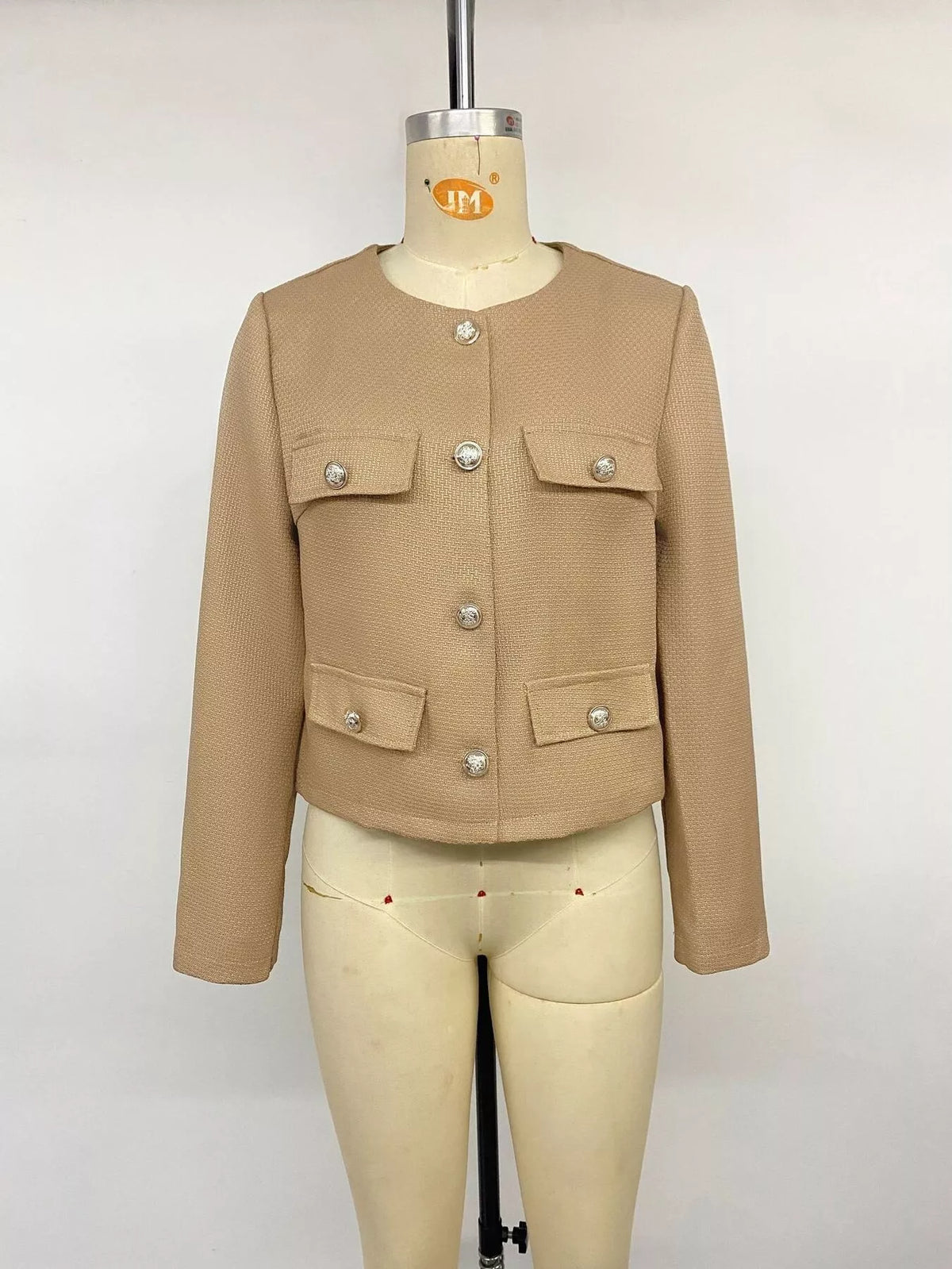 Tan textured cropped jacket with gold-tone buttons, front on mannequin