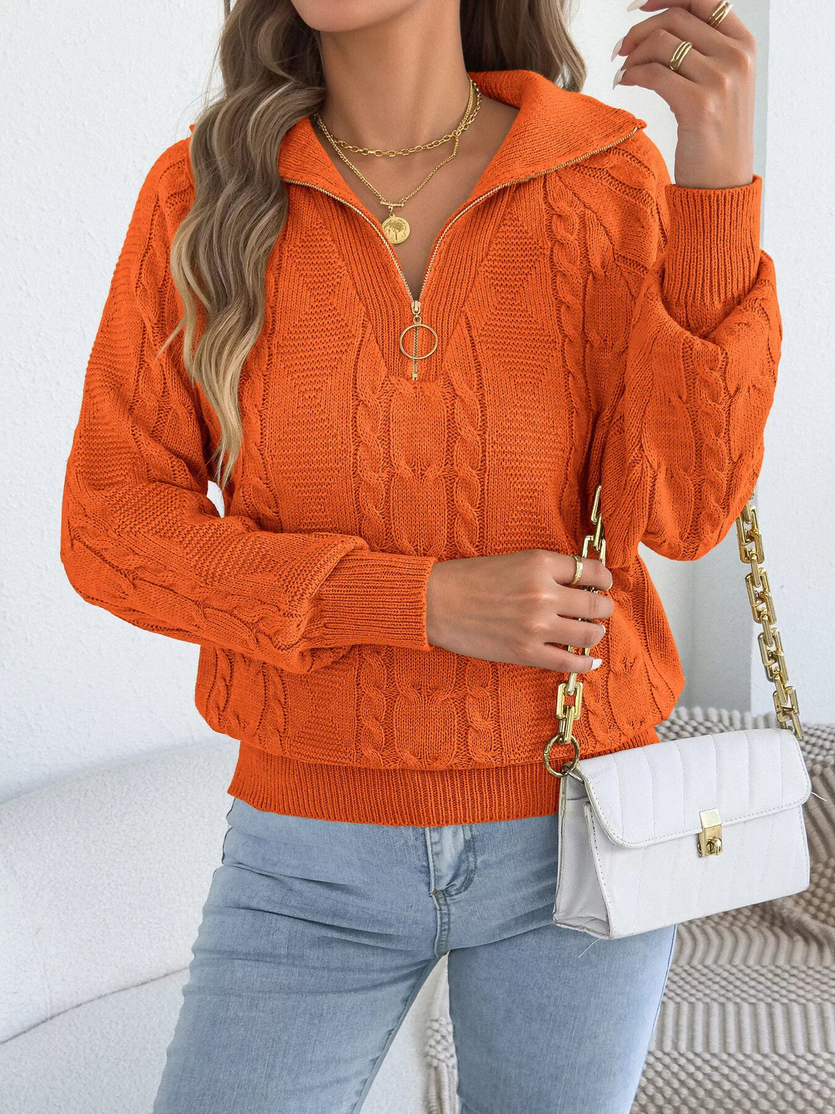 Orange quarter-zip cable knit sweater