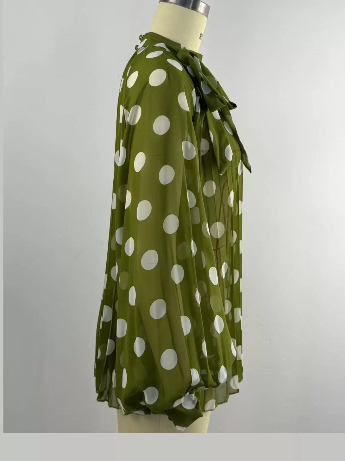 Green polka dot long sleeve blouse, detail view