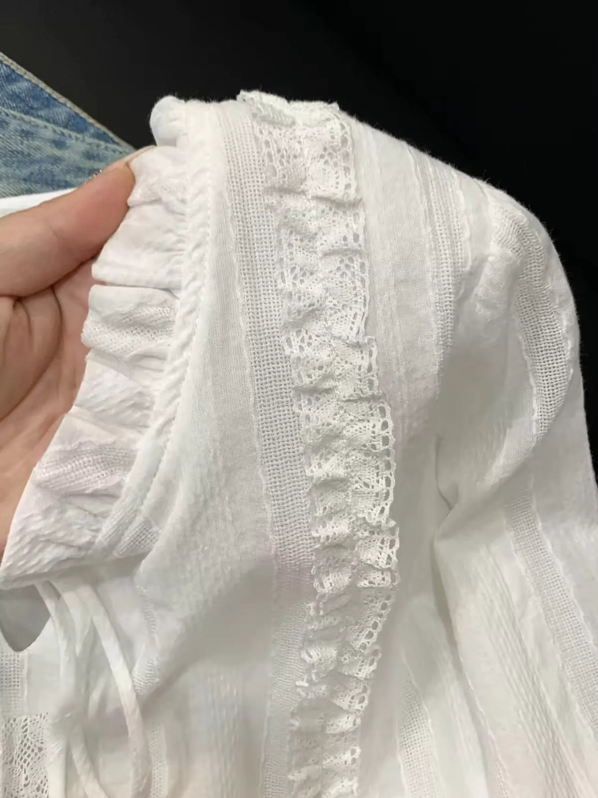 White - Lined lace-trimmed ruffle tie-neck blouse, detail view