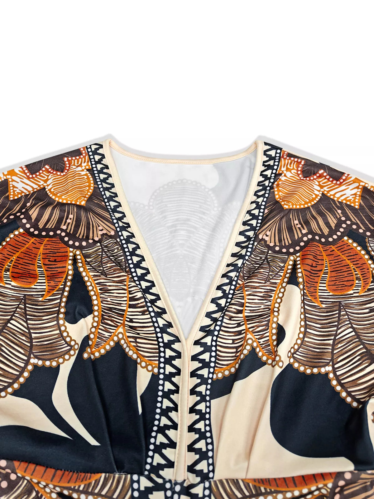 Orange, black and cream printed slit long-sleeve dress, neckline and print close-up