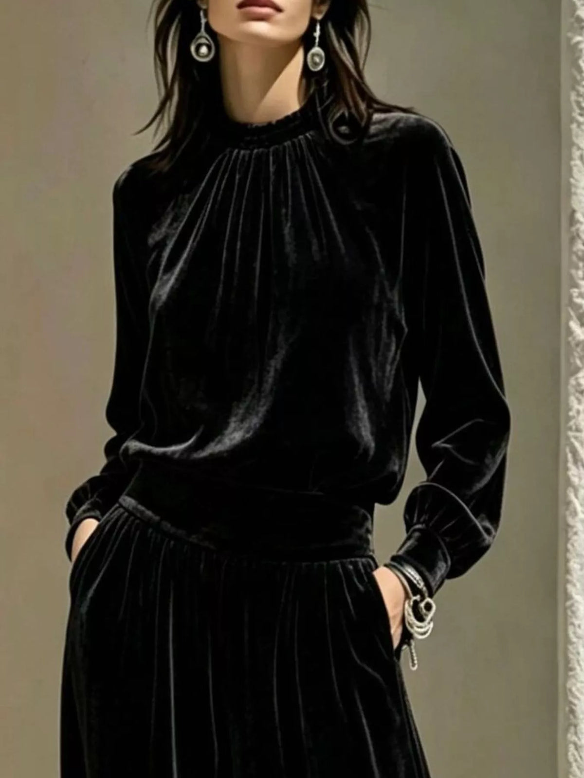 Black velvet mock-neck top and pants set, neckline and waist detail