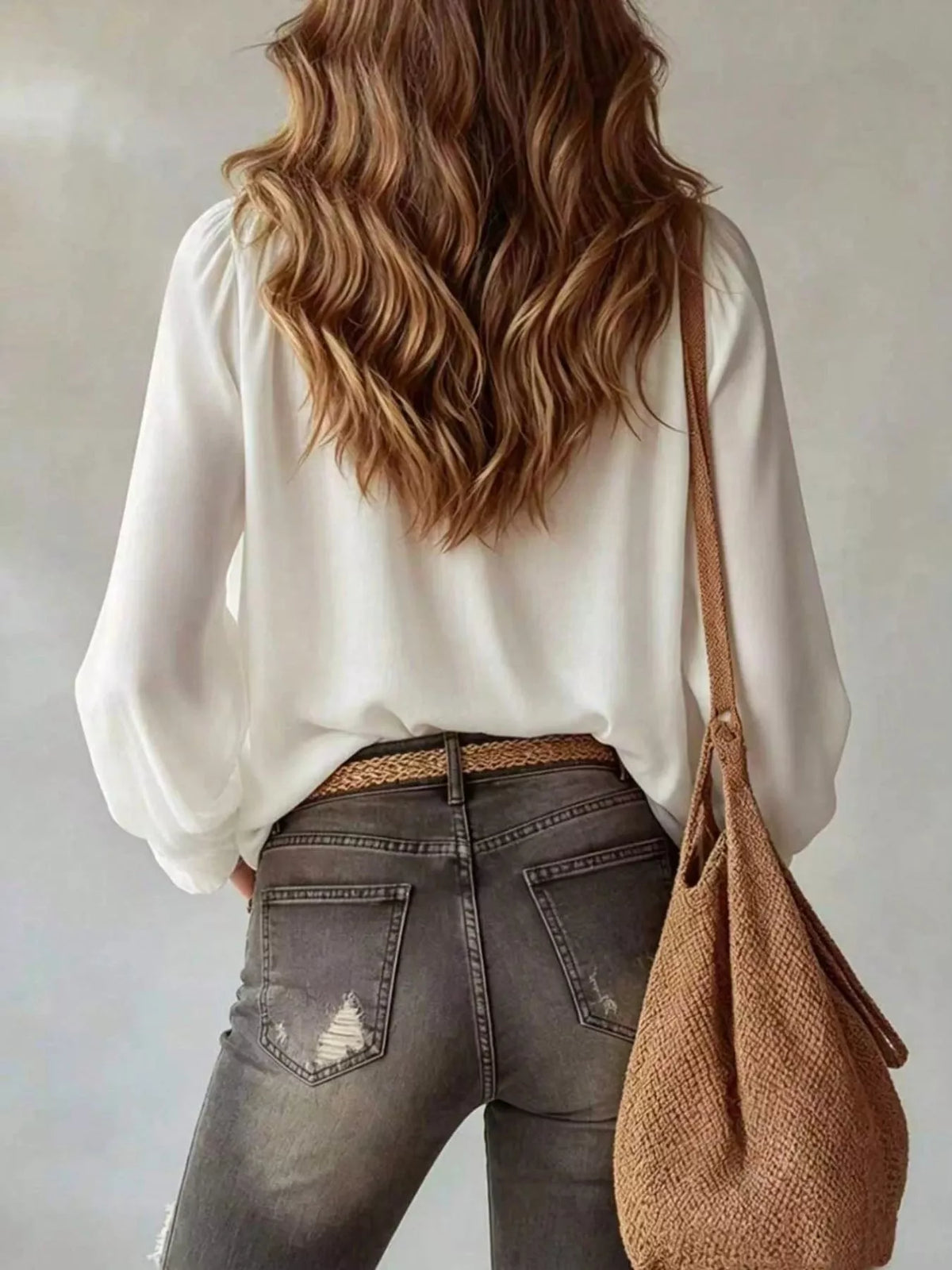 White ruffled v-neck blouse with tie-front detail, back view