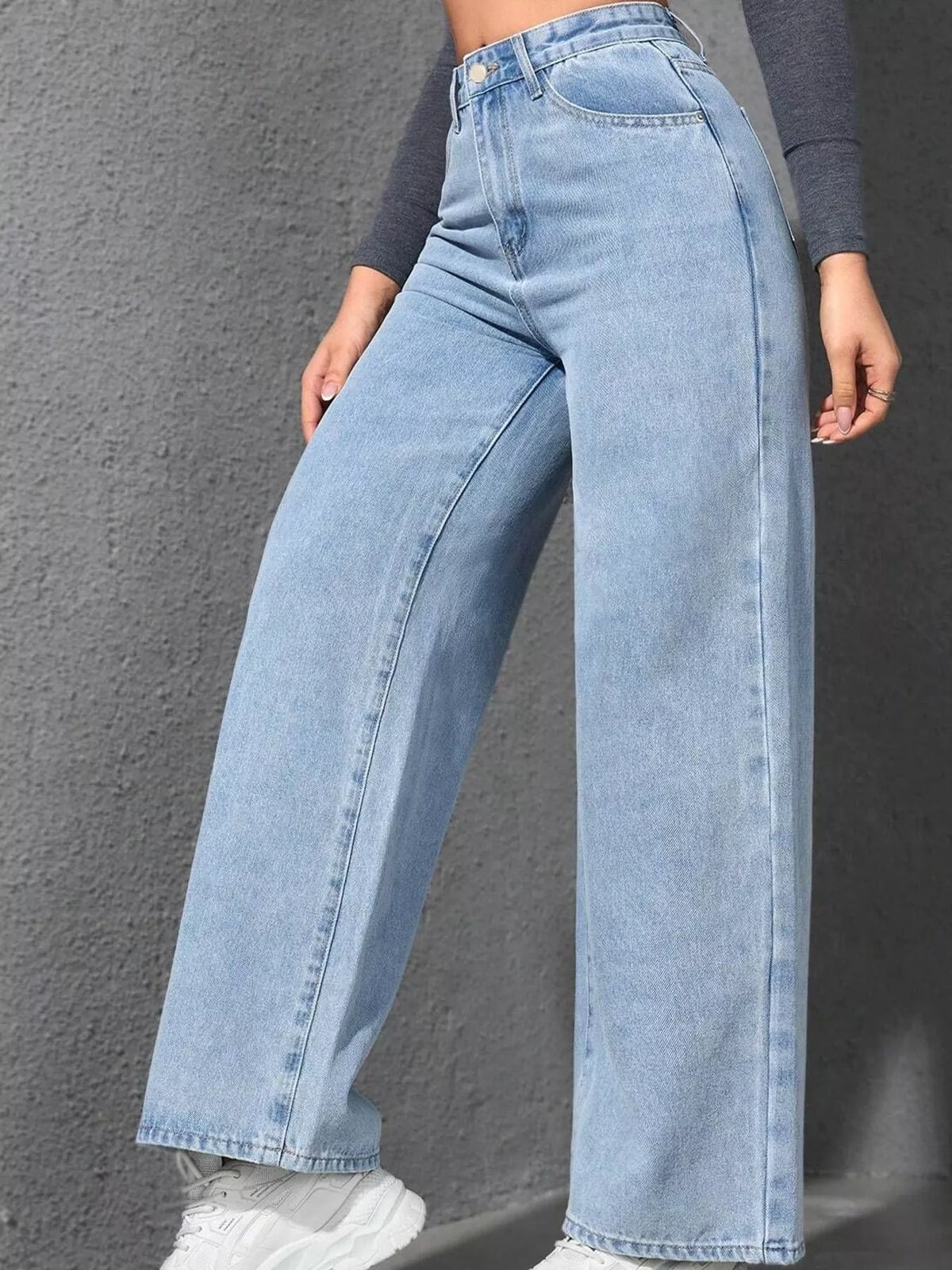 Light blue high waisted wide leg jeans, side view