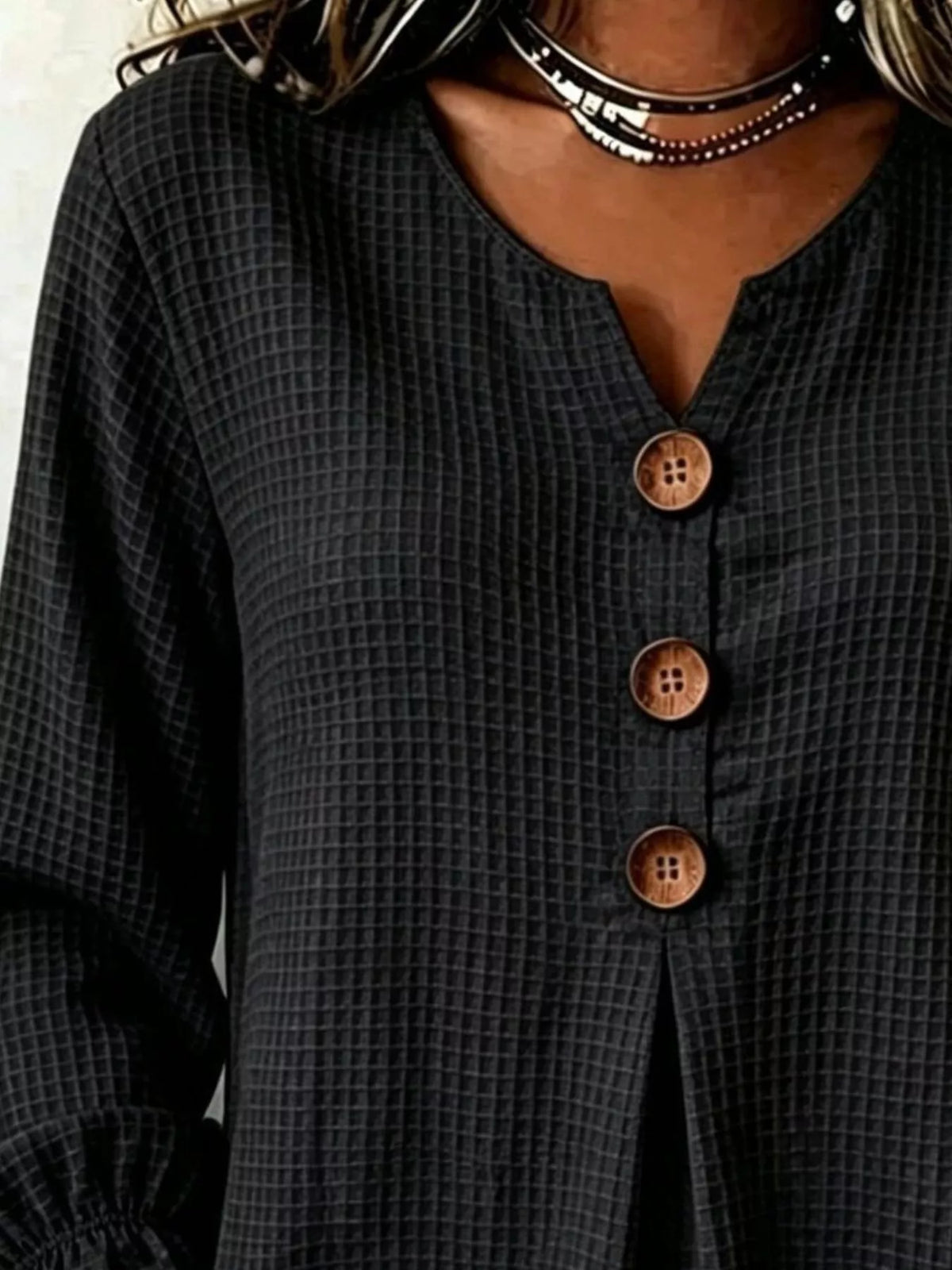 Black waffle knit blouse, split neckline and buttons