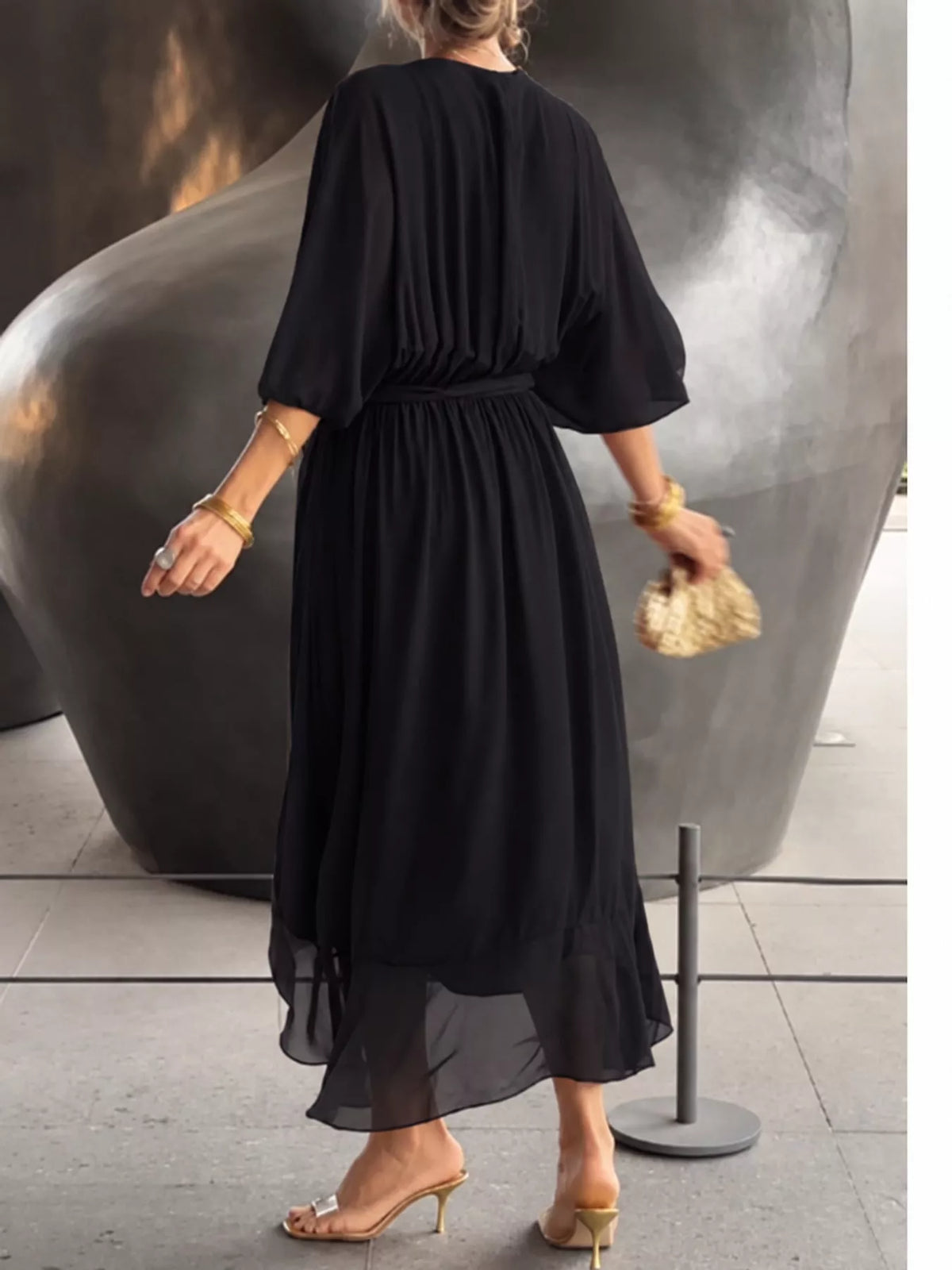 Black batwing sleeve wrap dress with waist tie, back view