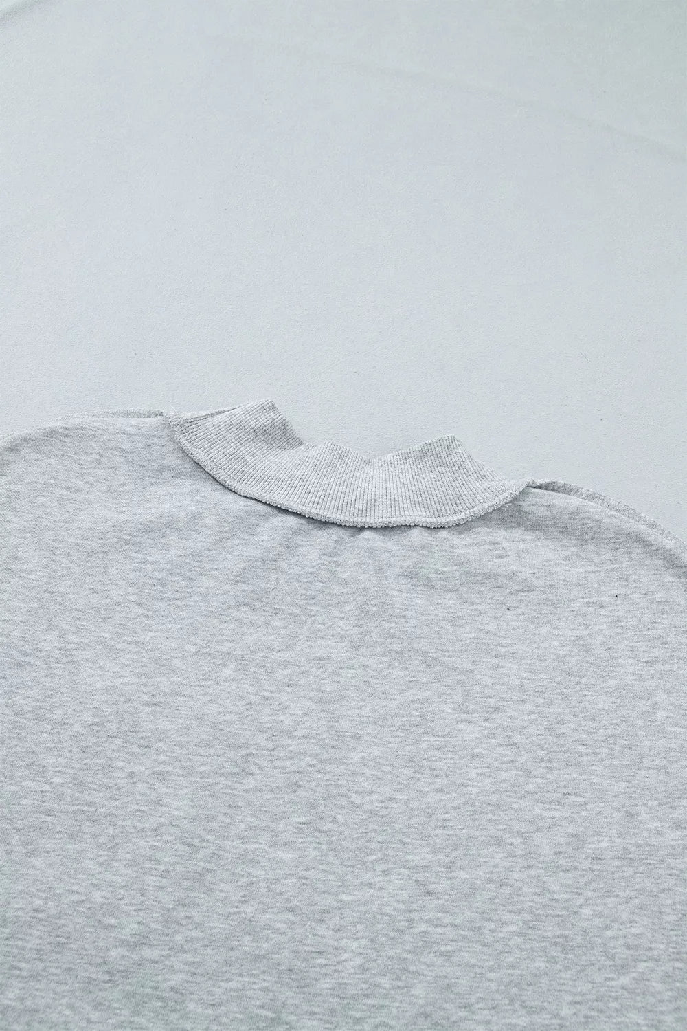 STATE Graphic Exposed Seam Mock Neck Sweatshirt in gray, back neckline detail
