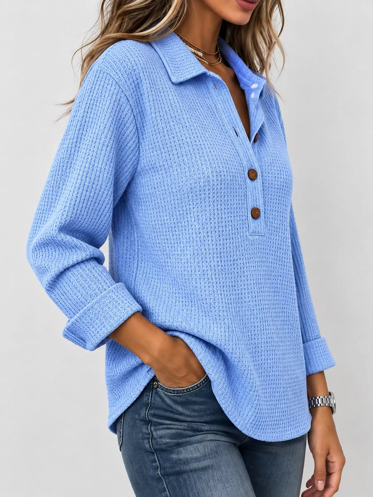 Light blue waffle knit long sleeve polo top, side view