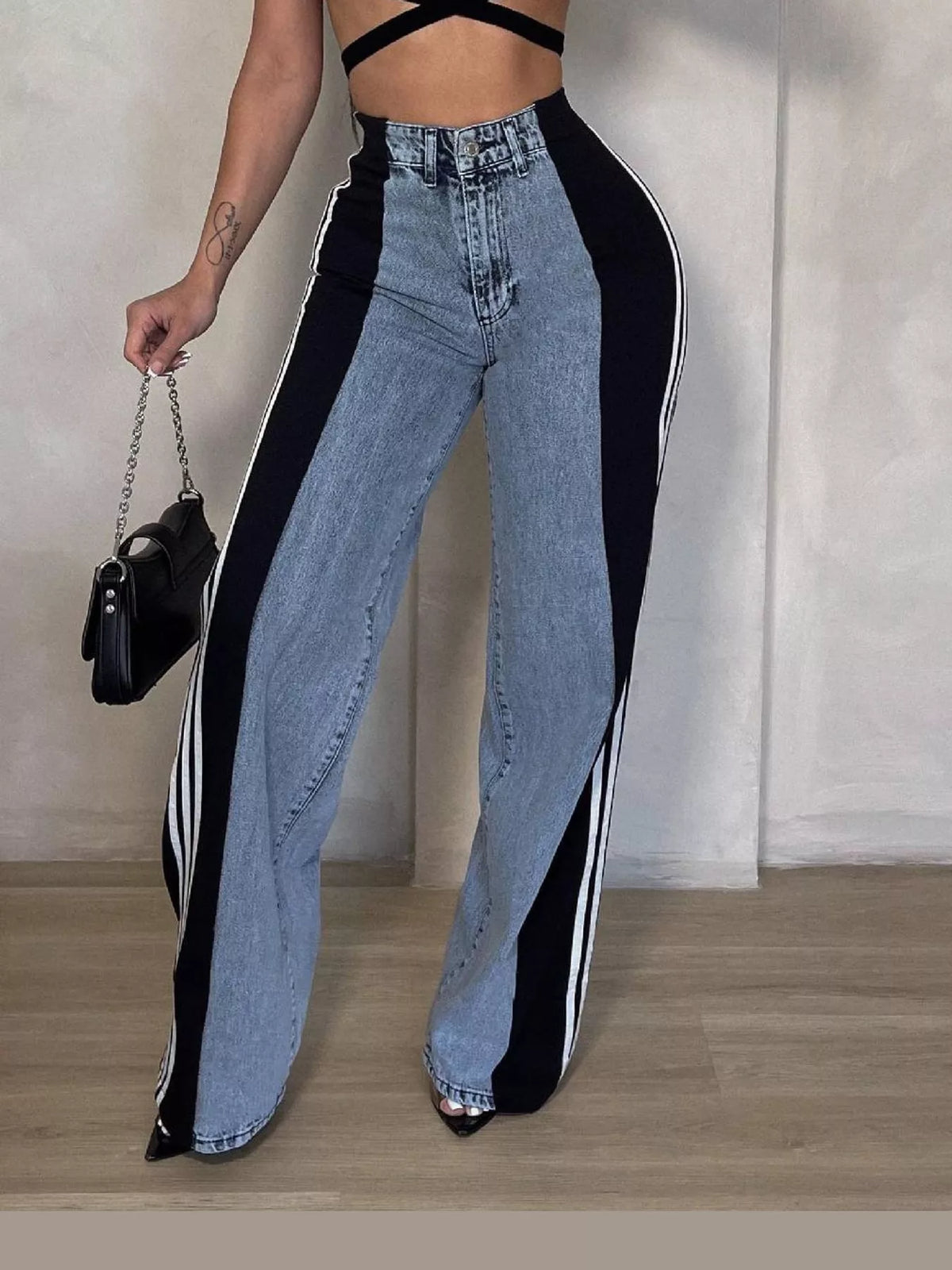 Black high-waisted wide-leg jeans with side stripe detail