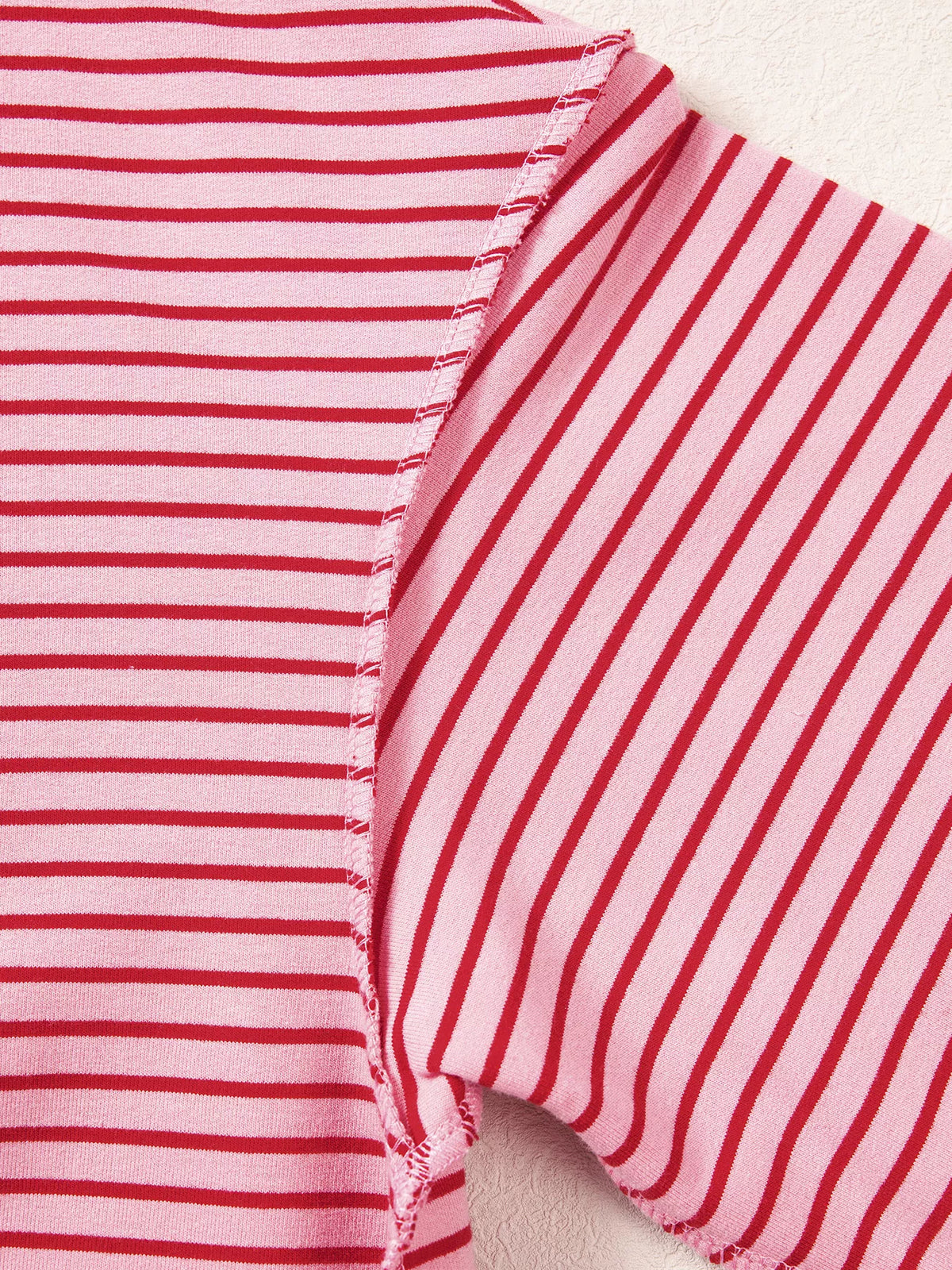 Striped fabric on pink and red striped striped color-block mock neck sweatshirt