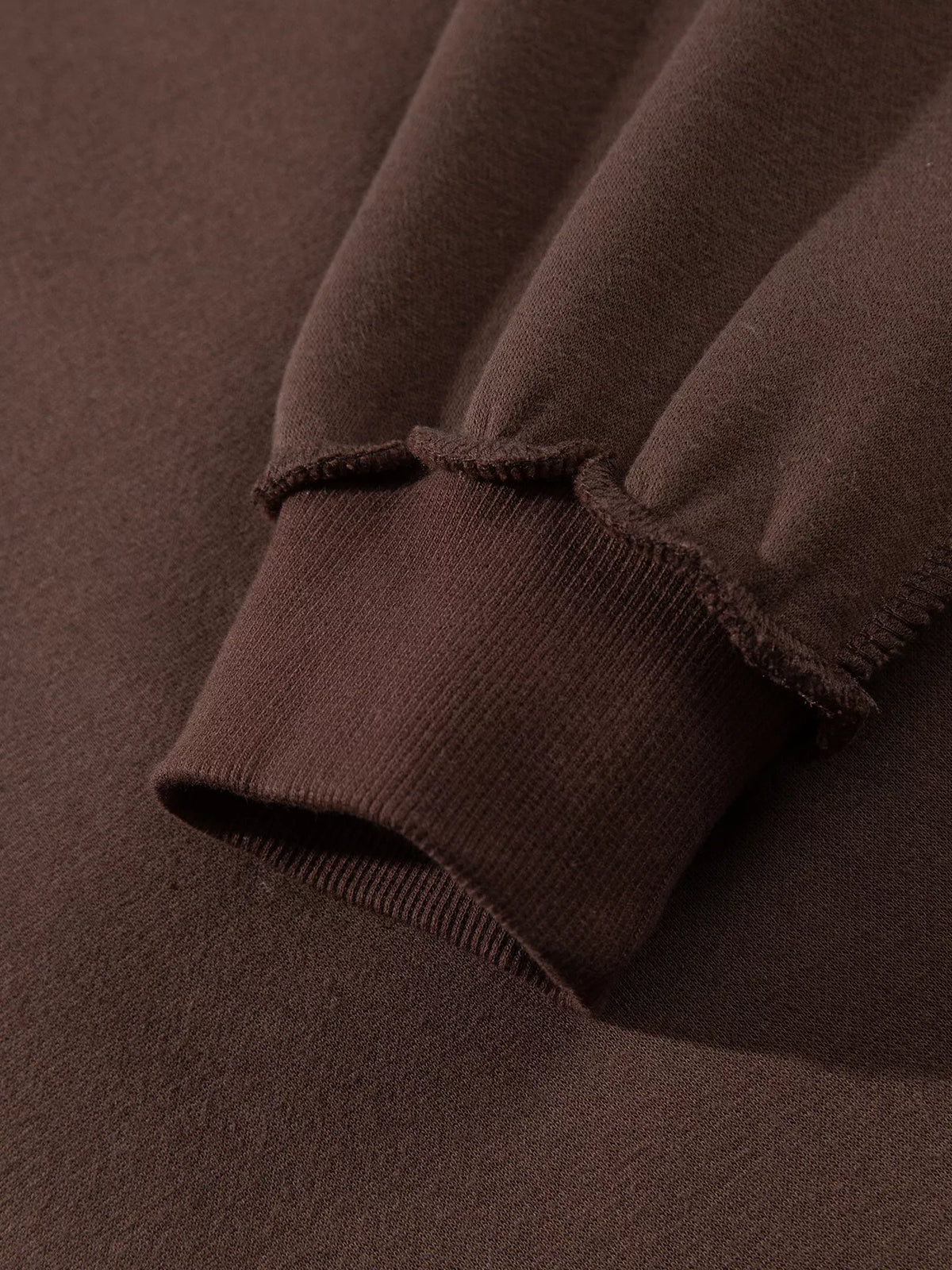 PRAY Polka Dot Embroidered Mock Neck Sweatshirt in dark brown, construction detail
