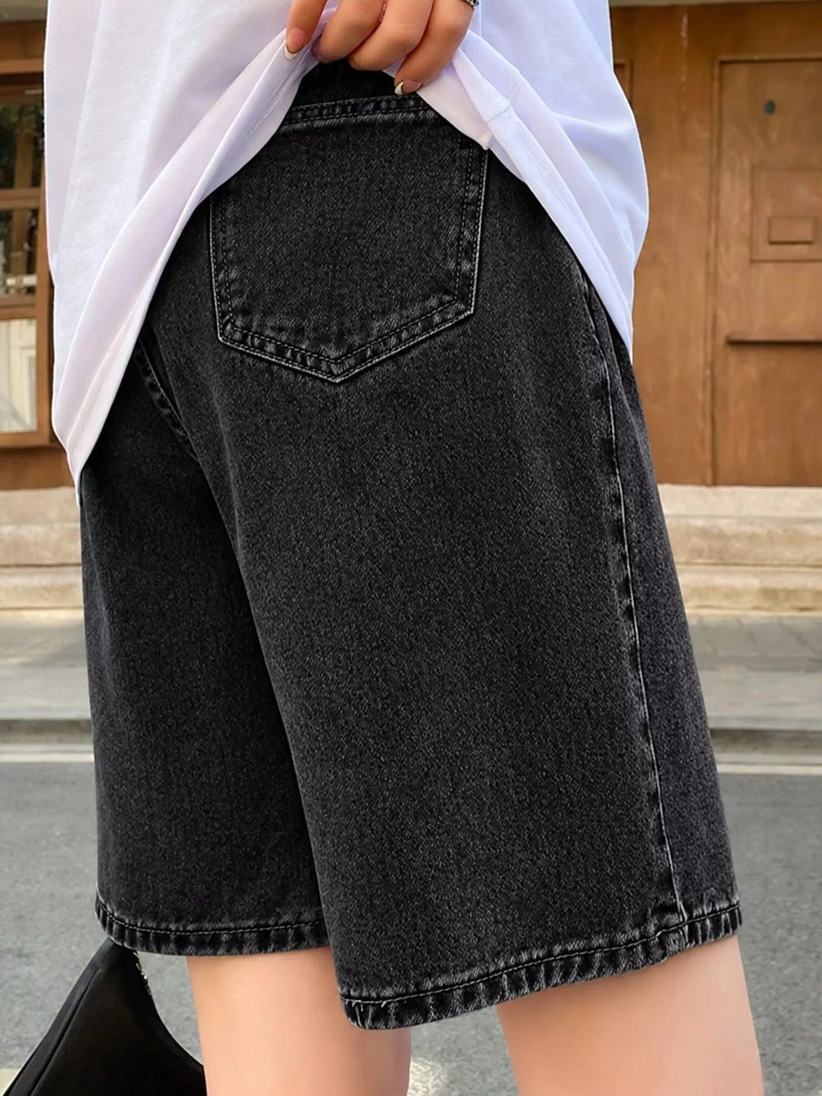 High-Waisted Loose Fit Denim Shorts, back view in black