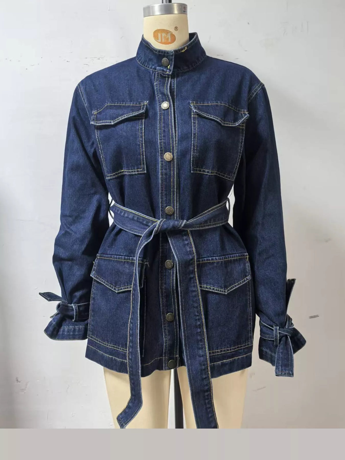 Dark blue button-up belted denim jacket — front view