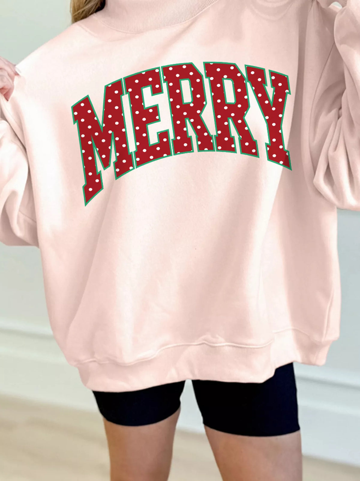 Apricot christmas lettering polka dot mock neck sweatshirt, detail view
