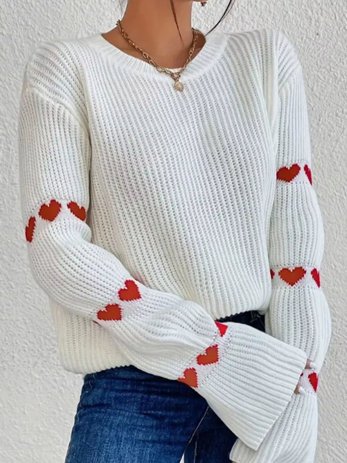 White and red heart-sleeve dropped-shoulder sweater, front view.
