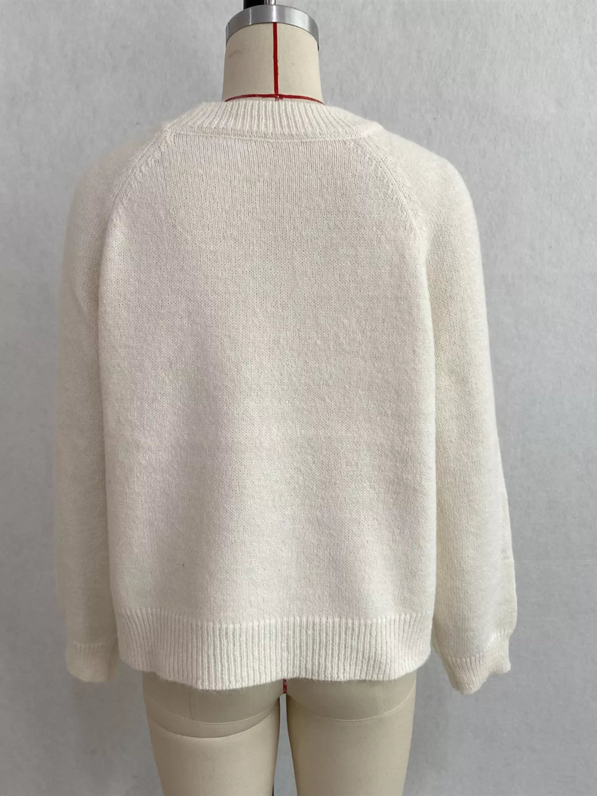 Floral embroidered round-neck sweater in white, back mannequin view