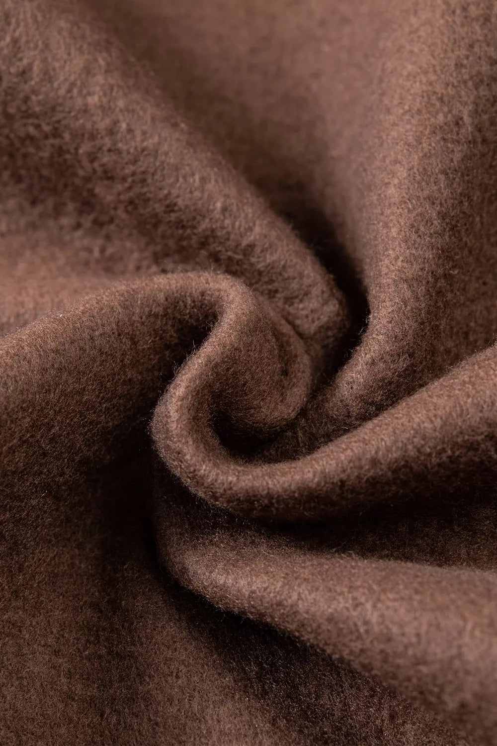 Brown wwjd patchwork graphic mock-neck sweatshirt, inner fabric close-up.