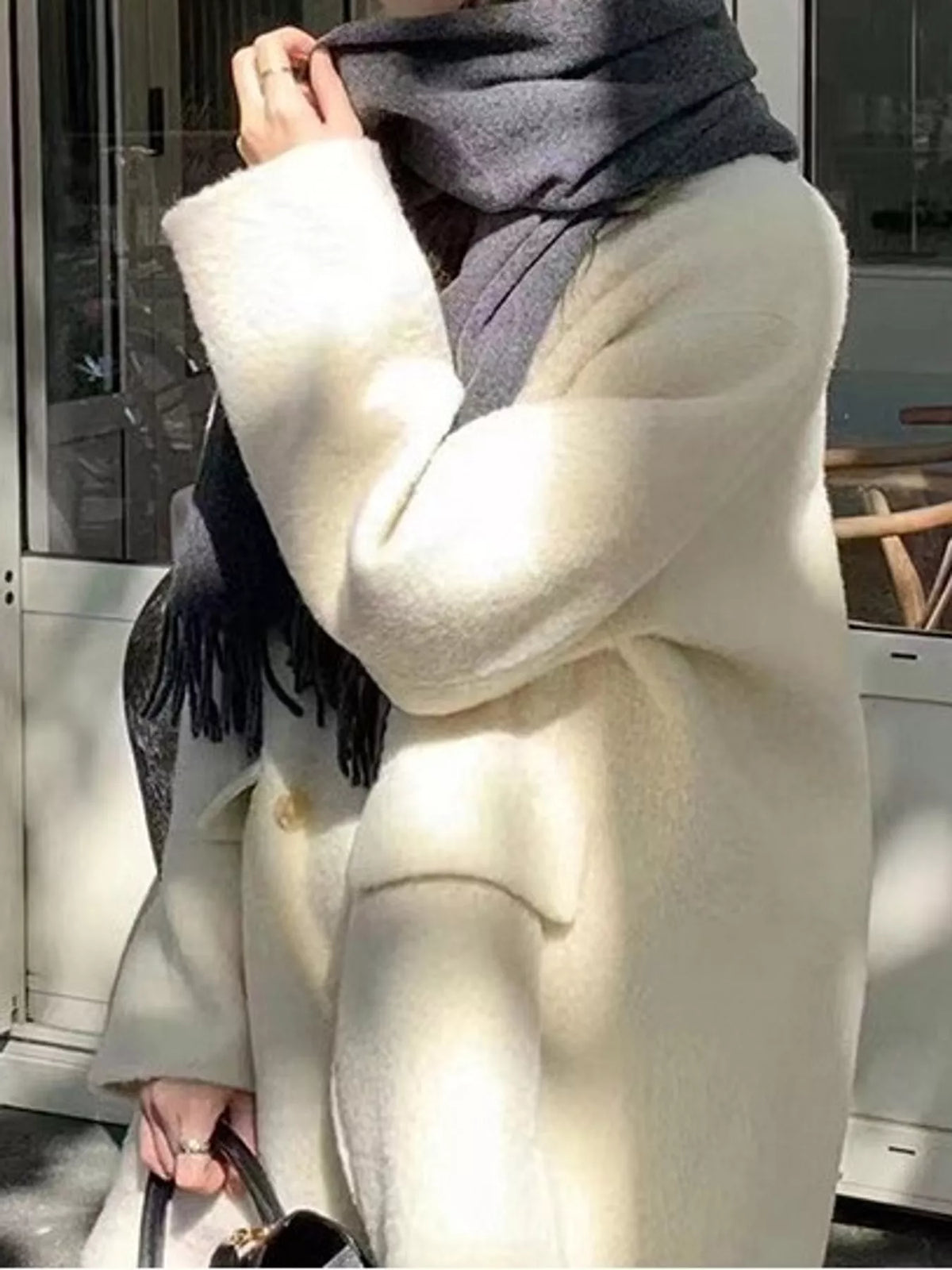 Cream double-breasted wool-blend coat — design and construction details