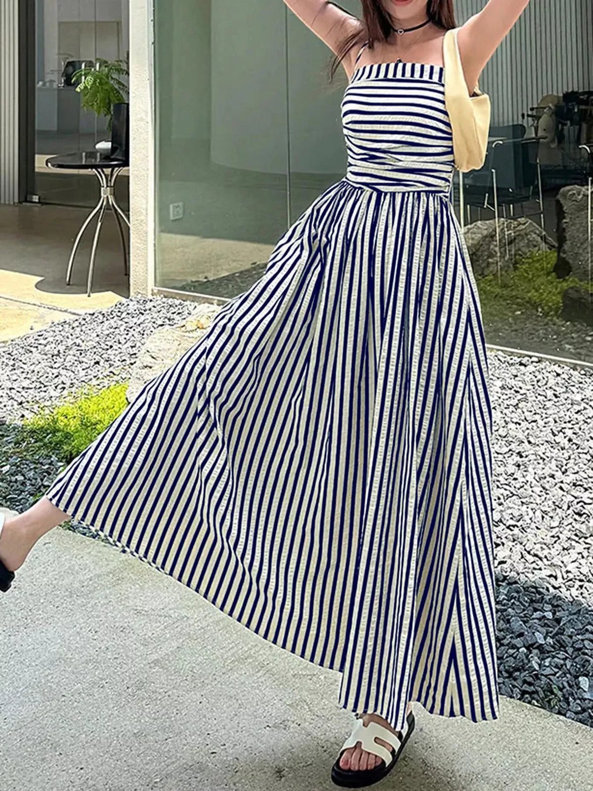 Navy and white striped spaghetti strap maxi dress with gathered bodice and pockets