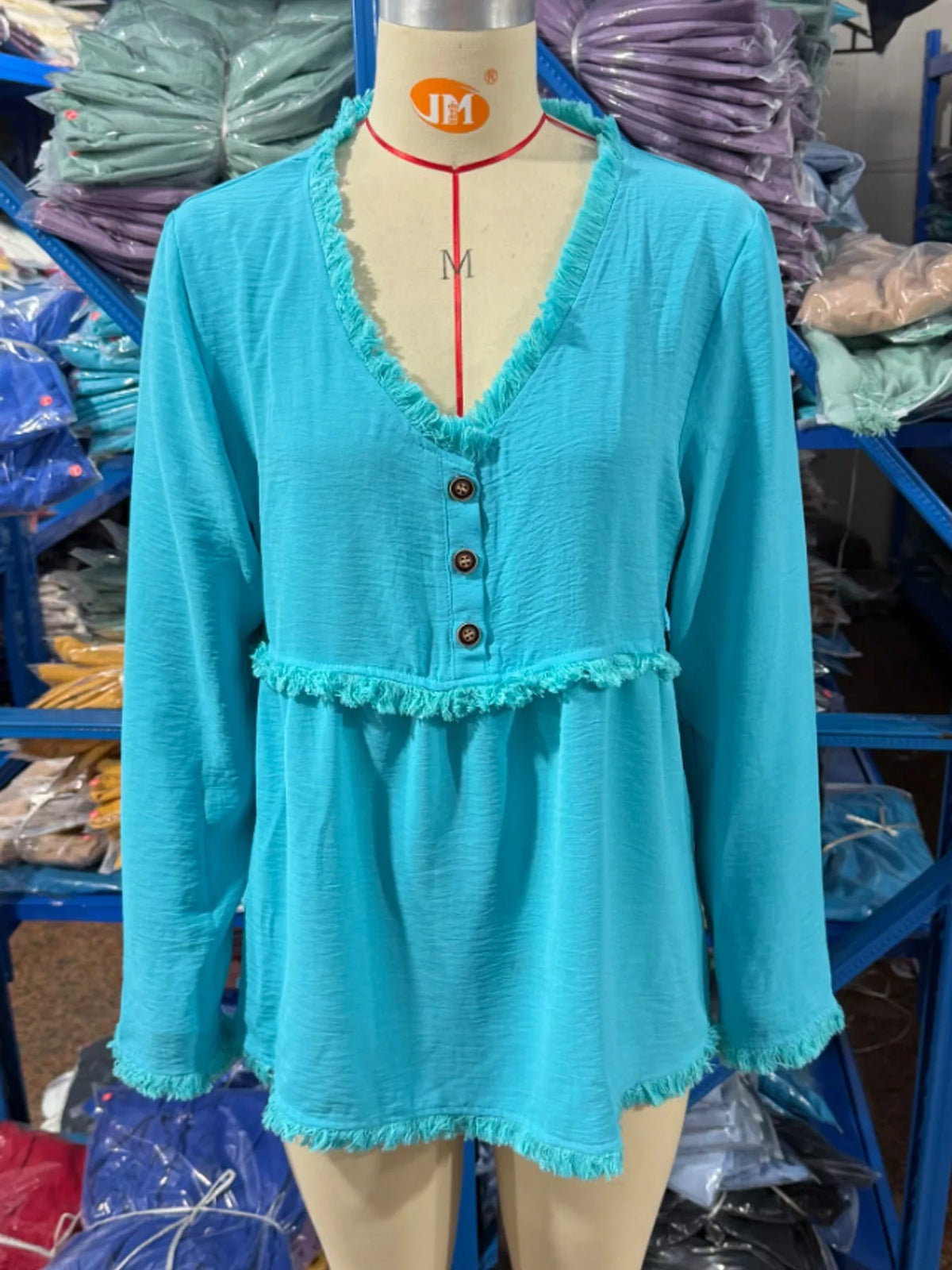 Fringe-trim blouse, turquoise mannequin front