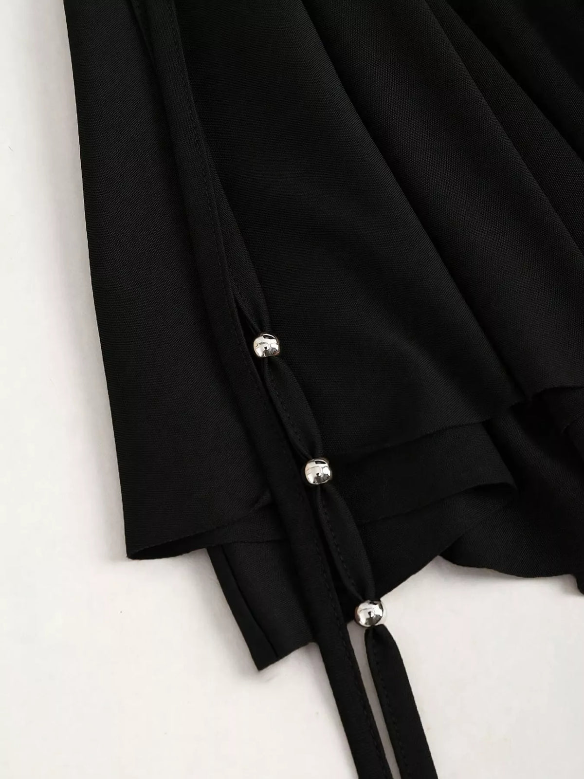 Ruched Asymmetrical Drawstring Mini Skirt, detail view in black