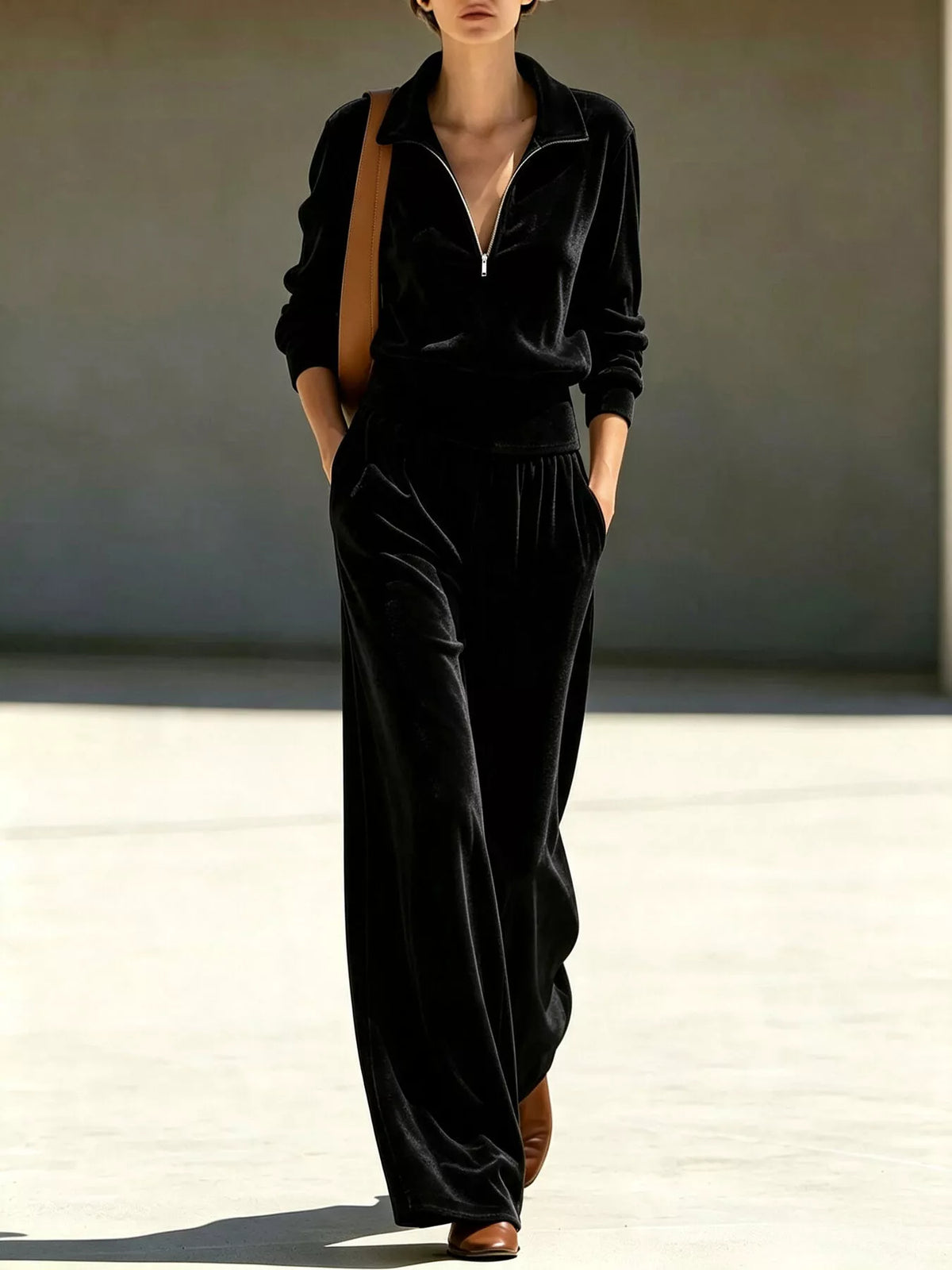 Black quarter-zip top and wide-leg pants set