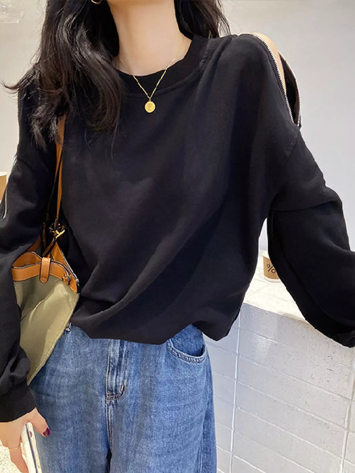 Women's Cold-Shoulder Zipper Detail Sweatshirt in black — front view